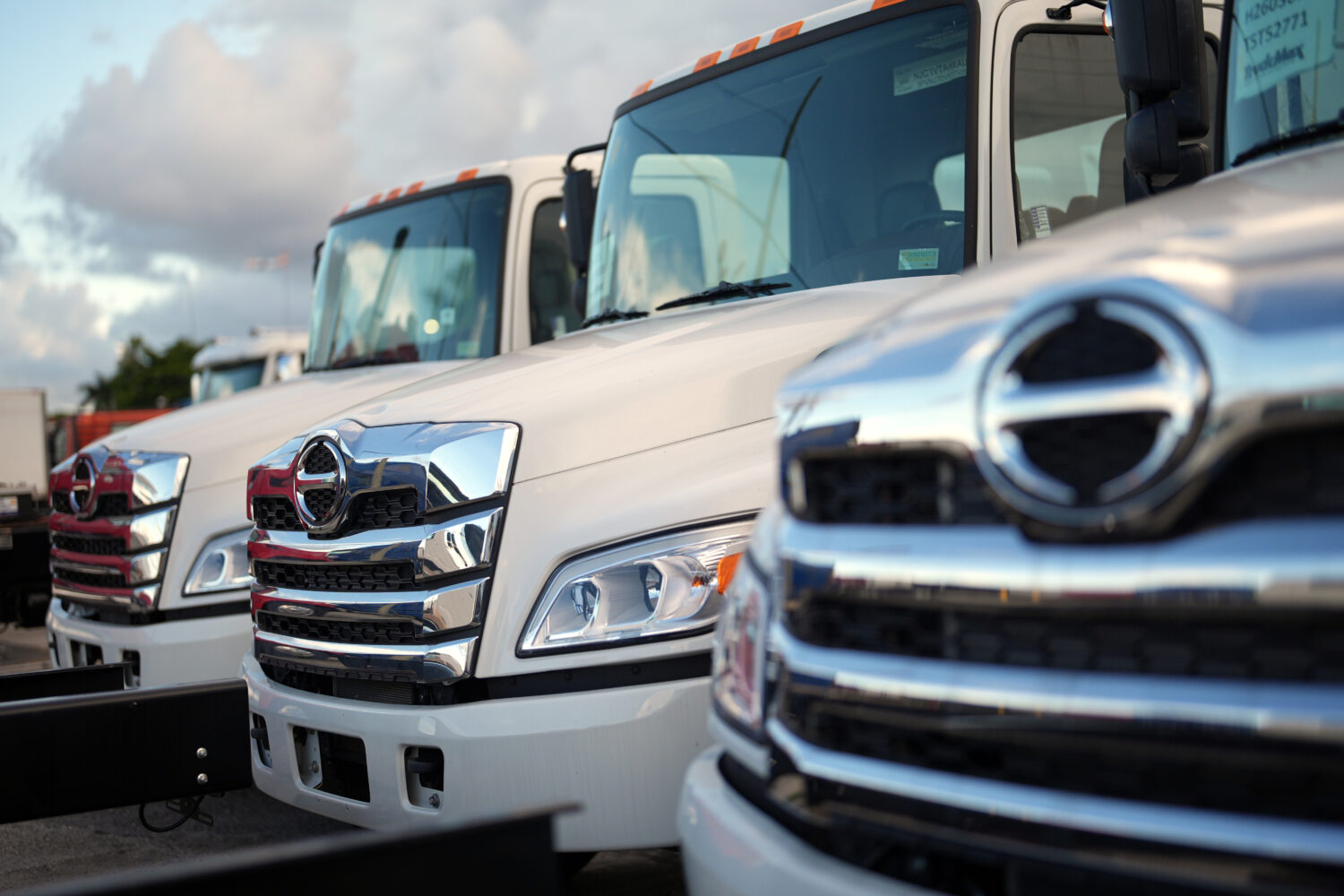Hino trucks sit on the lot at a truck dealership in Miami, Friday, Sept. 26, 2025. (AP Photo/Rebecc...