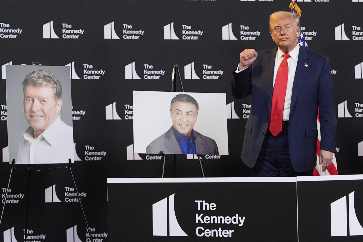 FILE - President Donald Trump stands beside photos of Kennedy Center Honors nominees at the Kennedy...