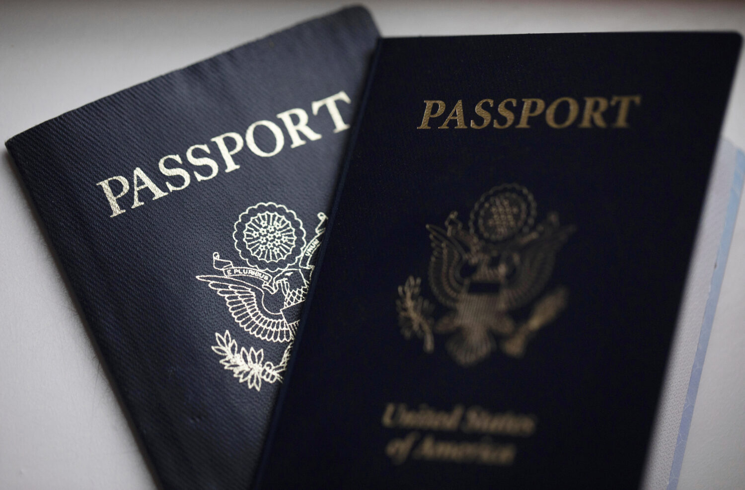 FILE - U.S. passports are arranged for a photograph in Tigard, Ore., Dec. 11, 2021. (AP Photo/Jenny...