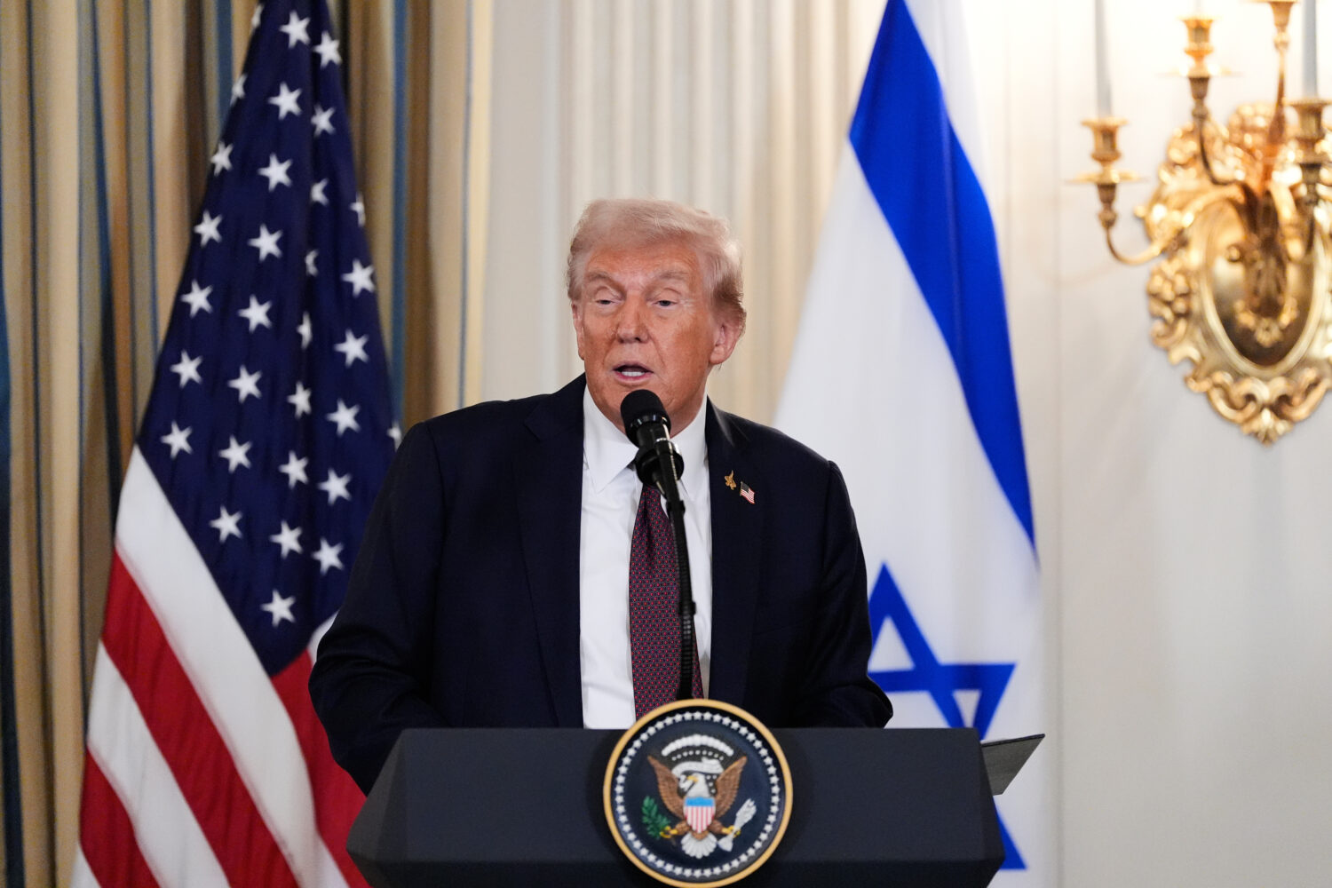 President Donald Trump speaks during a news conference with Israel's Prime Minister Benjamin Netany...