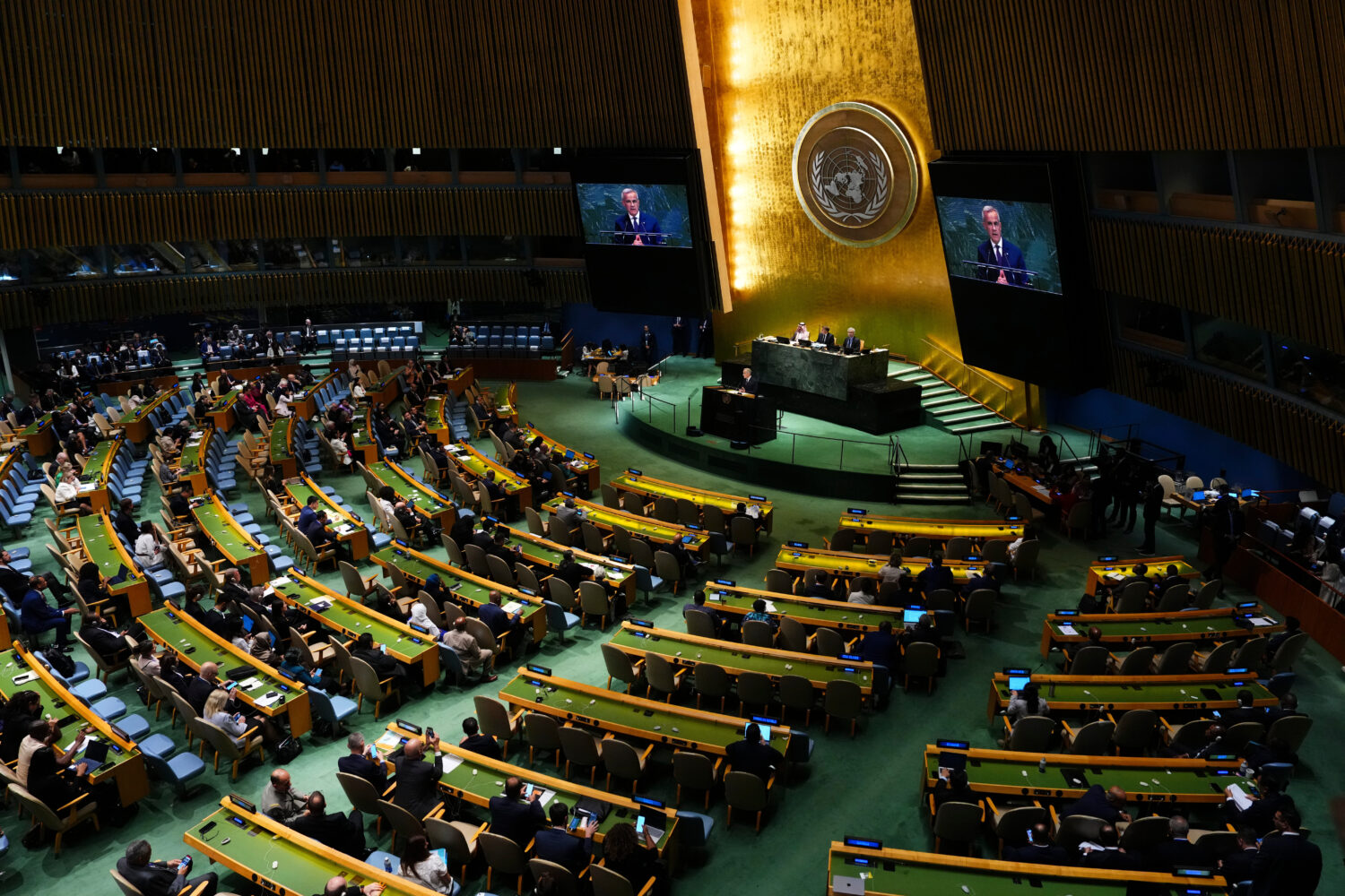 Canada's Prime Minister Mark Carney delivers a speech as he takes part in a high-level internationa...