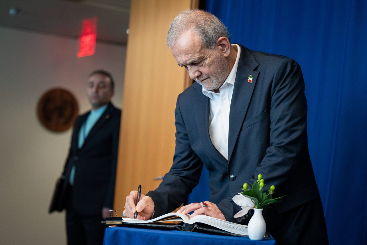 Masoud Pezeshkian, the President of Iran, signs a note in a United Nations book during the U.N. Gen...