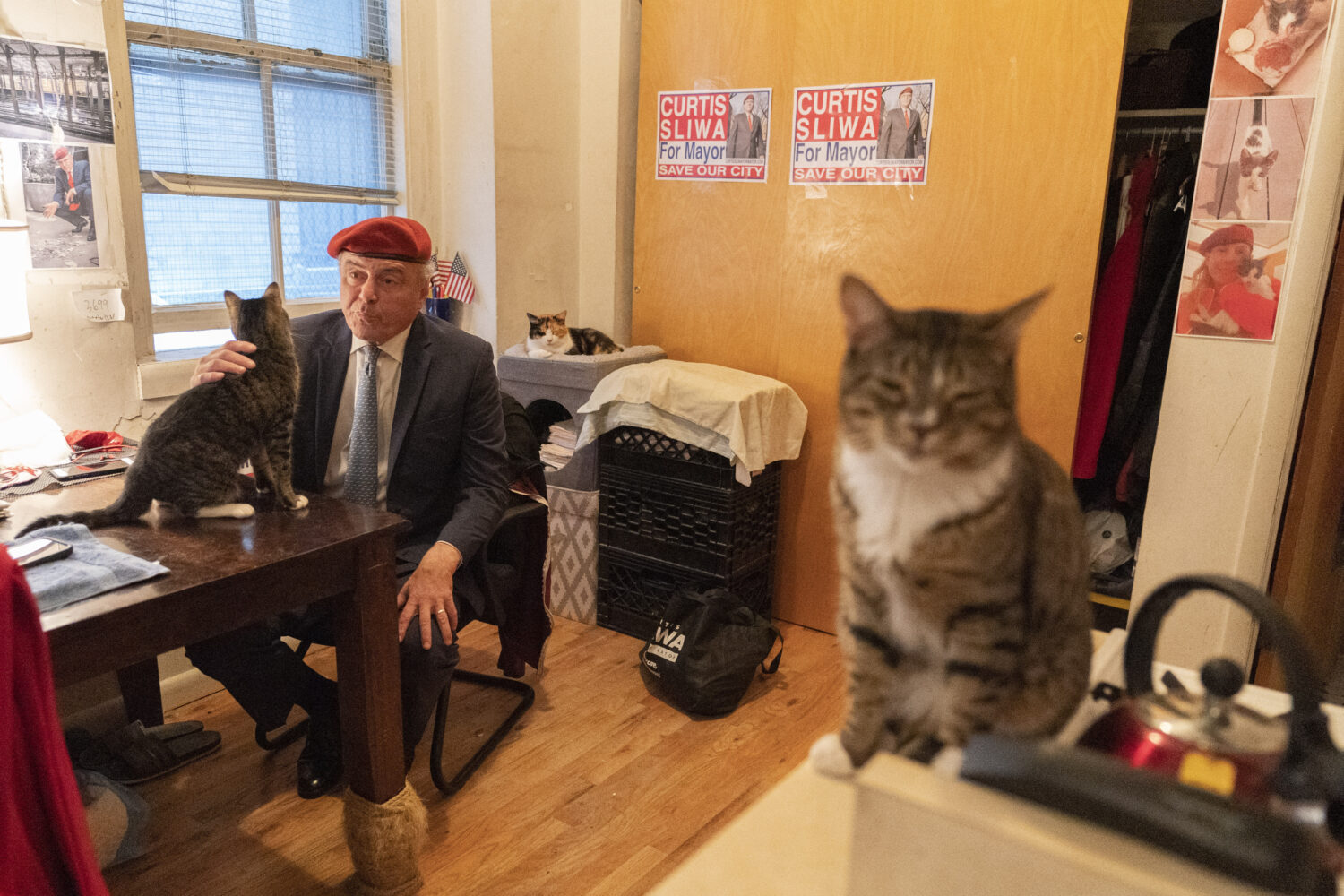 FILE - New York City Republican mayoral candidate Curtis Sliwa pets one of his cats as he speaks du...