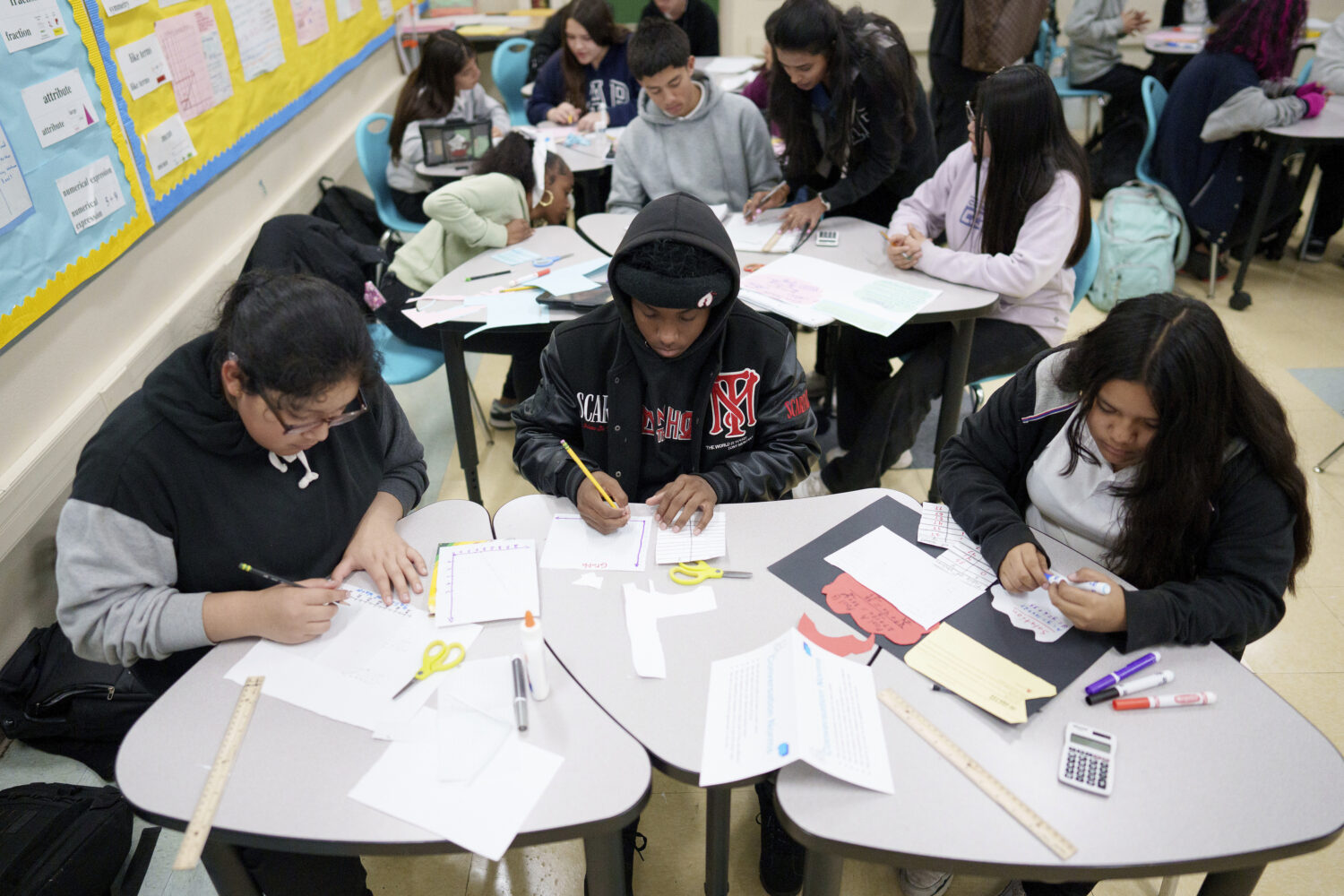 FILE - Students work in a classroom at Benjamin O. Davis Middle School in Compton, Calif., Thursday...