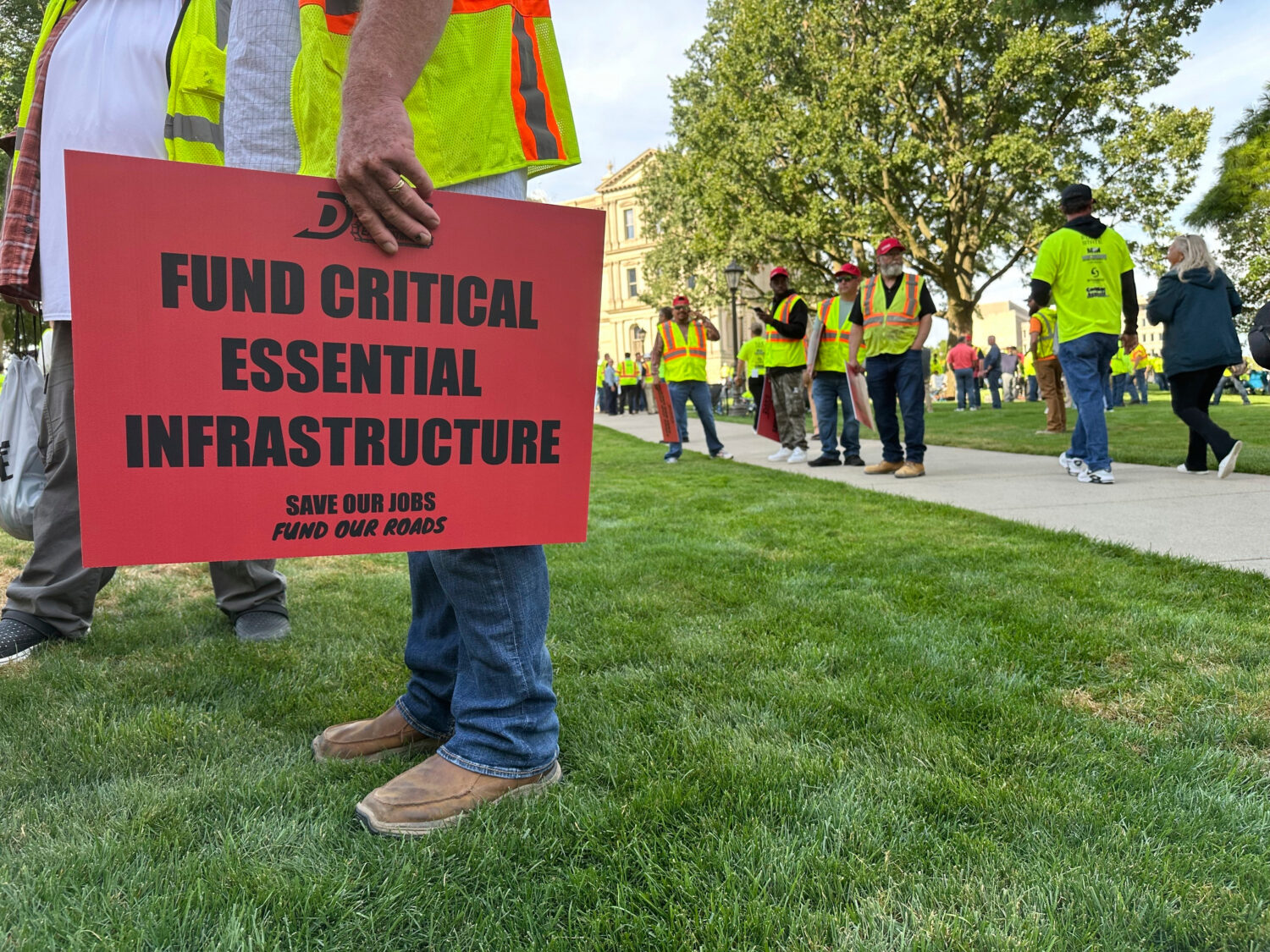 Construction workers gather at Michigan's statehouse in Lansing, Mich., Wednesday, Sept. 3, 2025, t...