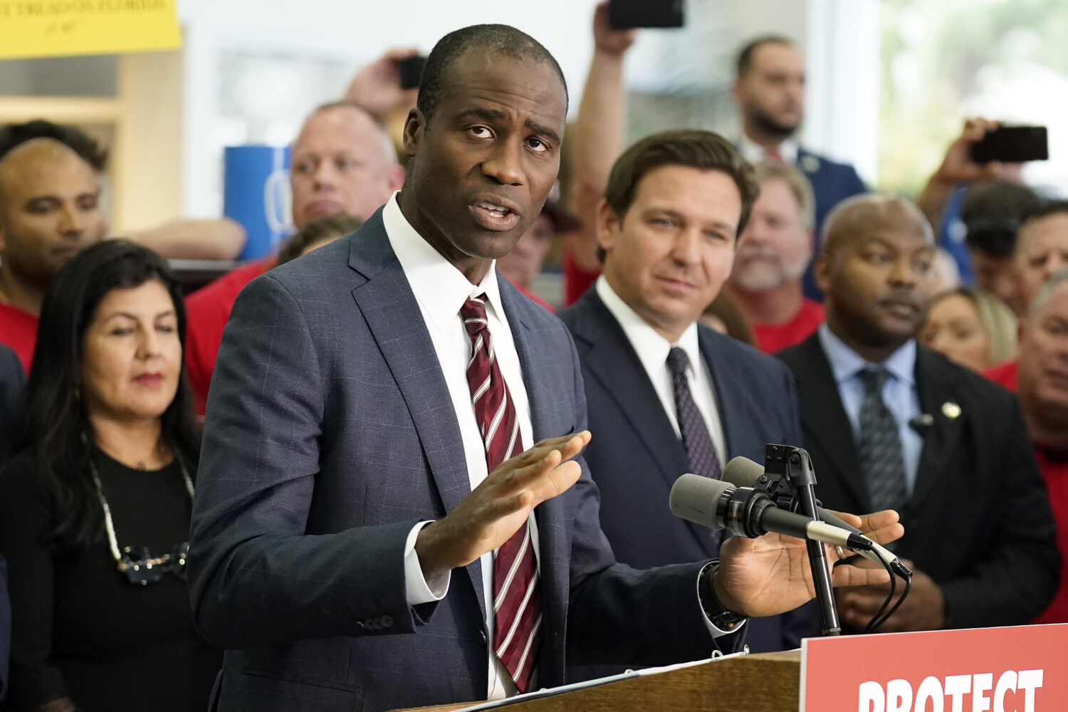 FILE - Florida Surgeon General Dr. Joseph Ladapo gestures as speaks to supporters and members of th...