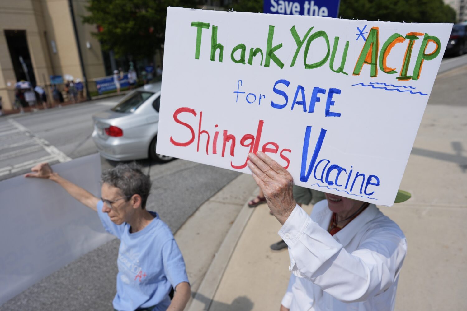 FILE - Demonstrators rally for support of the CDC during a meeting of the Advisory Committee in Imm...