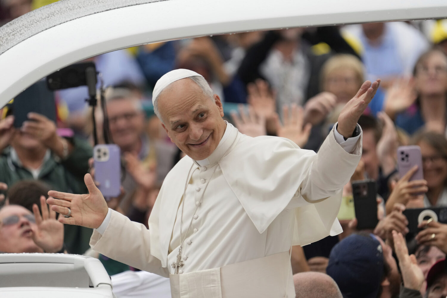 FILE - Pope Leo XIV arrives for his weekly general audience in St. Peter's Square, at the Vatican, ...