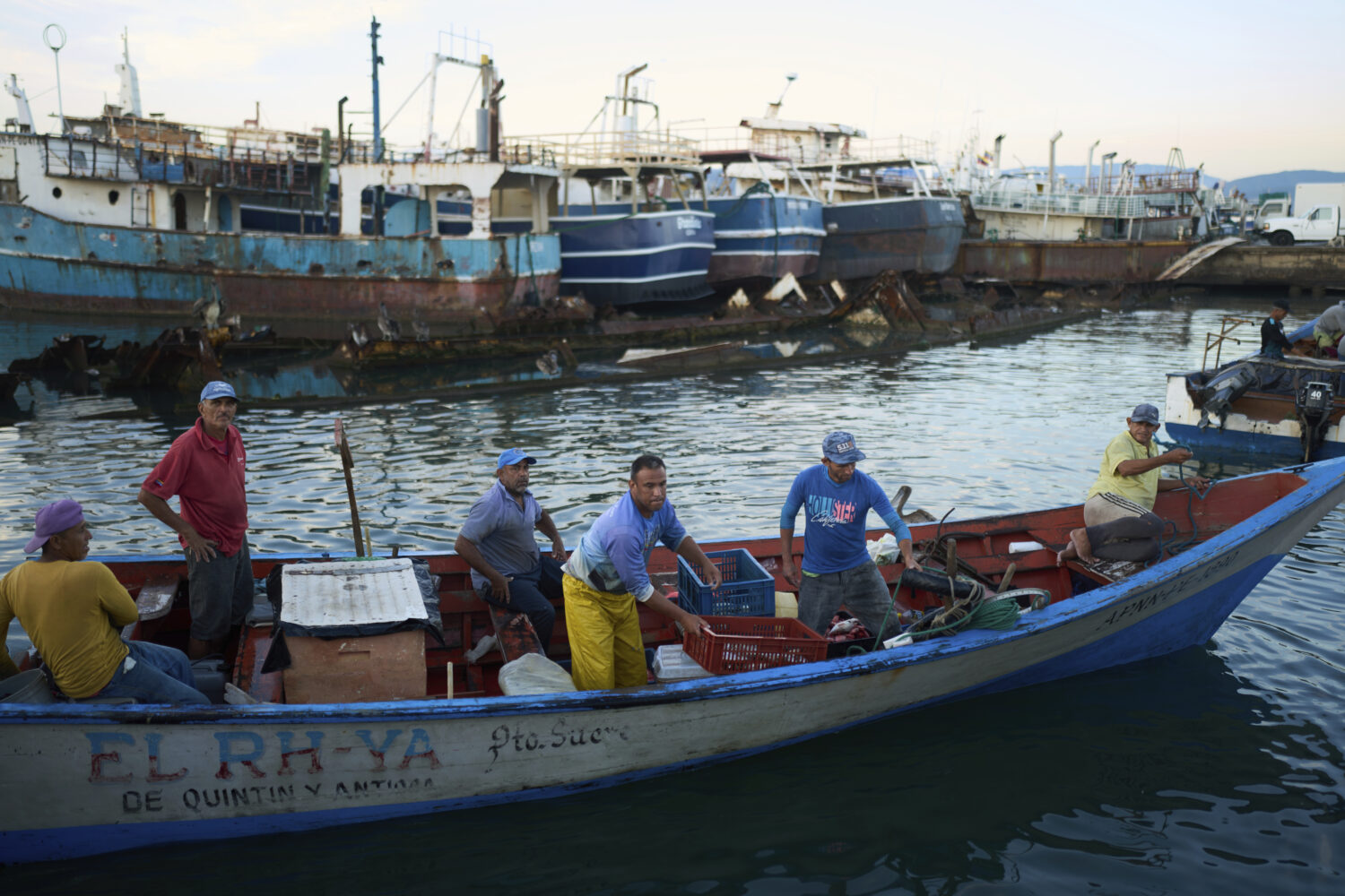 Fishermen arrive at the port in Cumana, capital of Venezuela's Sucre state, Monday, Sept. 15, 2025....