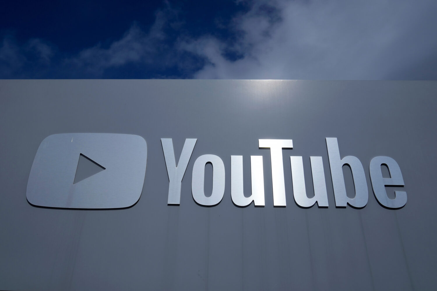 FILE - A YouTube sign is shown near the company's headquarters in San Bruno, Calif., Wednesday, Mar...
