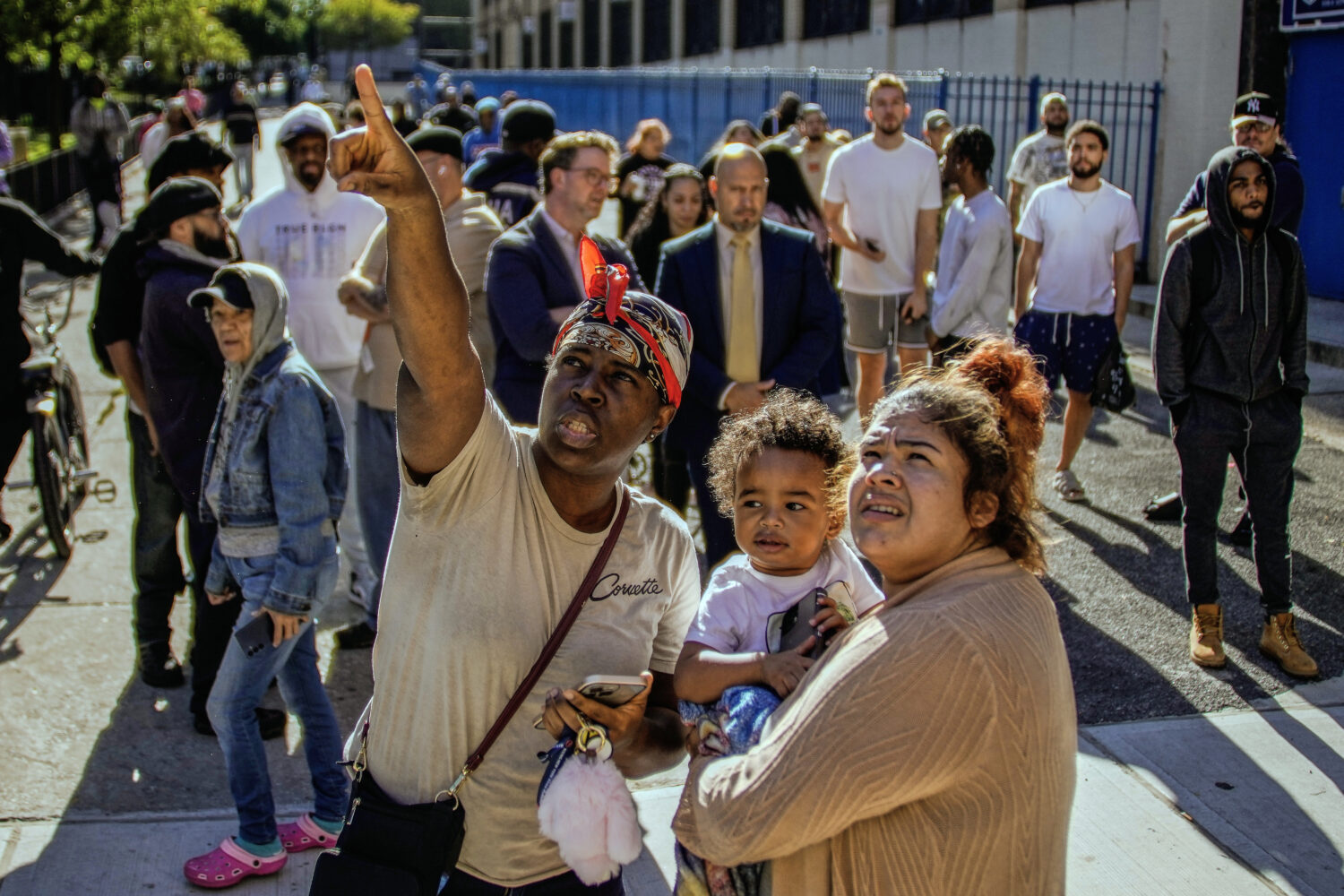 People take a look at part of a building that collapsed in the Bronx borough of New York, Wednesday...