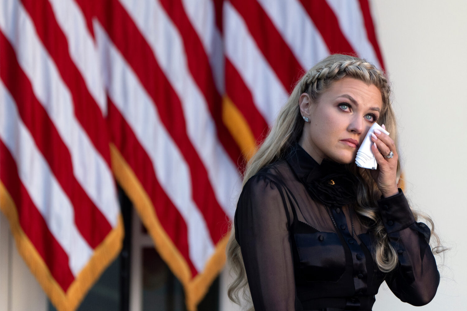 Erika Kirk reacts after President Donald Trump posthumously awarded the Presidential Medal of Freed...