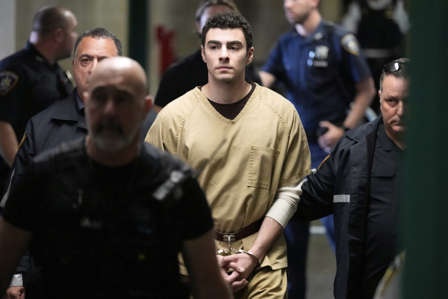 Luigi Mangione is escorted into Manhattan state court in New York, Tuesday, Sept. 16, 2025. (AP Pho...