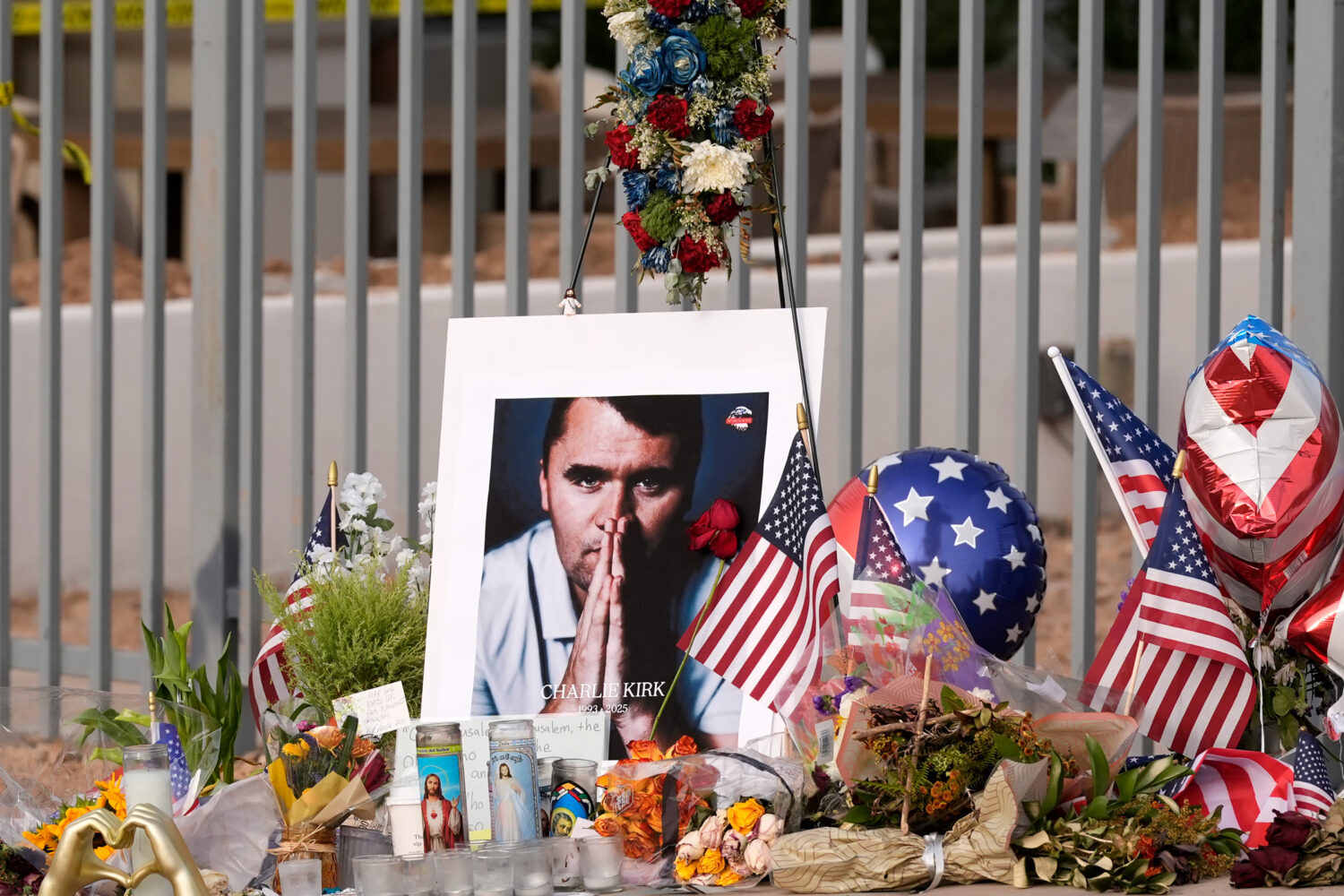 FILE - A makeshift memorial grows in size at the Turning Point USA headquarters after the shooting ...