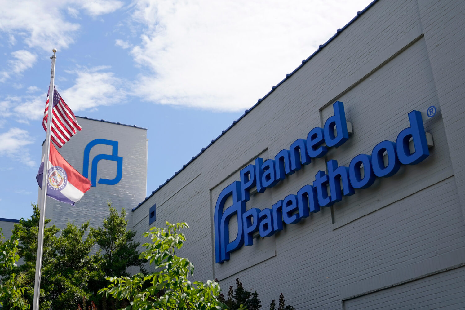 FILE - A Missouri and an American flag fly outside the Planned Parenthood in St. Louis on June 24, ...