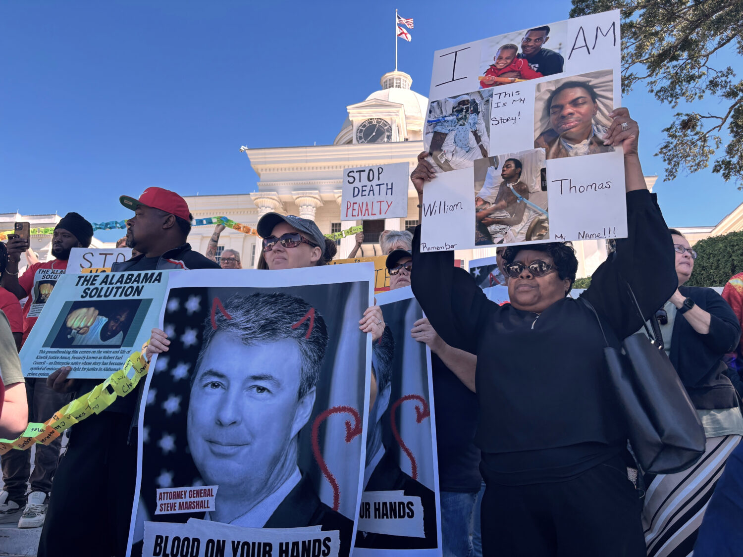 Family members of people incarcerated in Alabama prisons rally outside the Alabama Capitol in Montg...