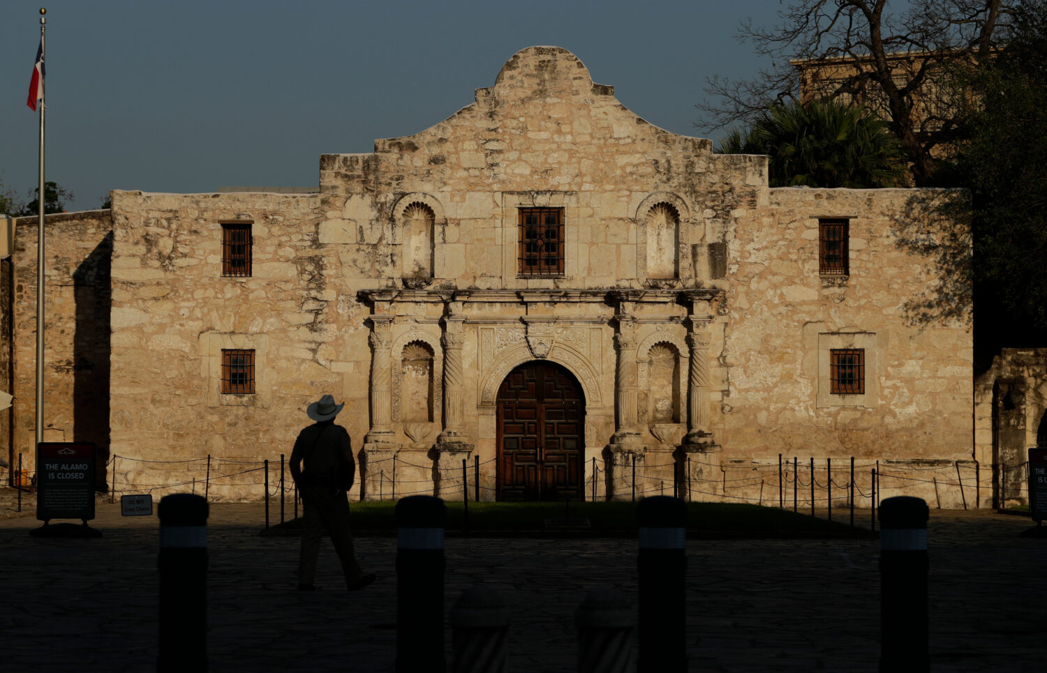 FILE - A ranger patrols the ground of the Alamo in San Antonio, Thursday, March 26, 2020. (AP Photo...