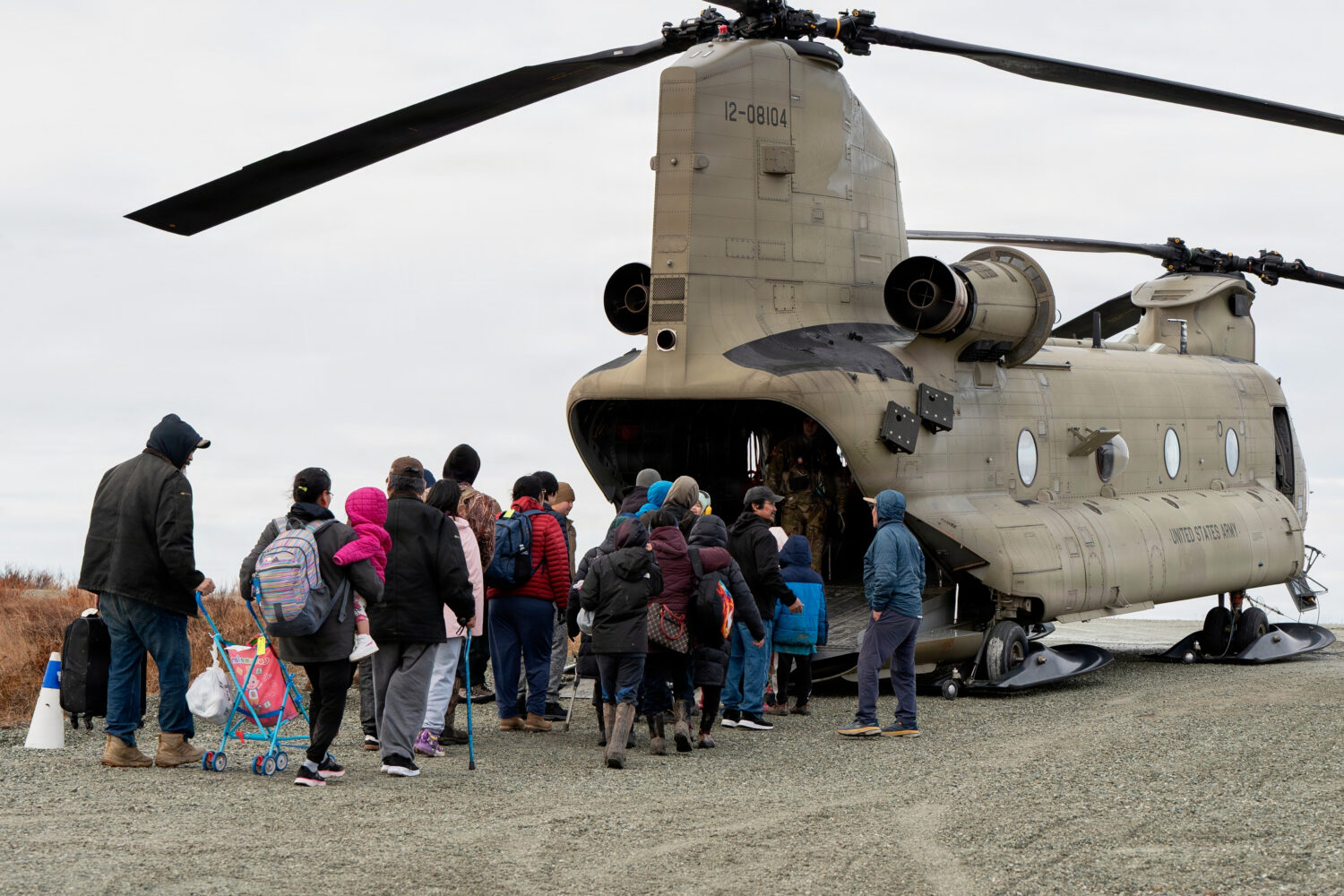 In this photo provided by the Alaska Army National Guard, displaced people are evacuated from Kwigi...