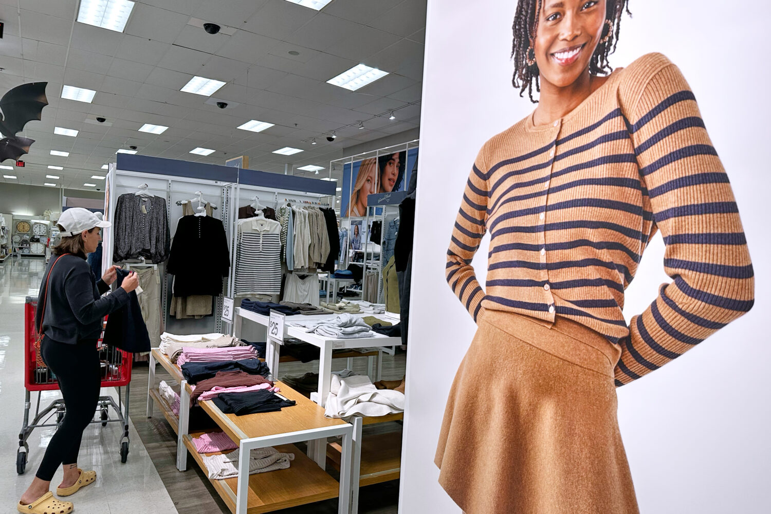 FILE - A shopper shops at a retail store in Arlington Heights, Ill., Tuesday, Sept. 23, 2025. (AP P...