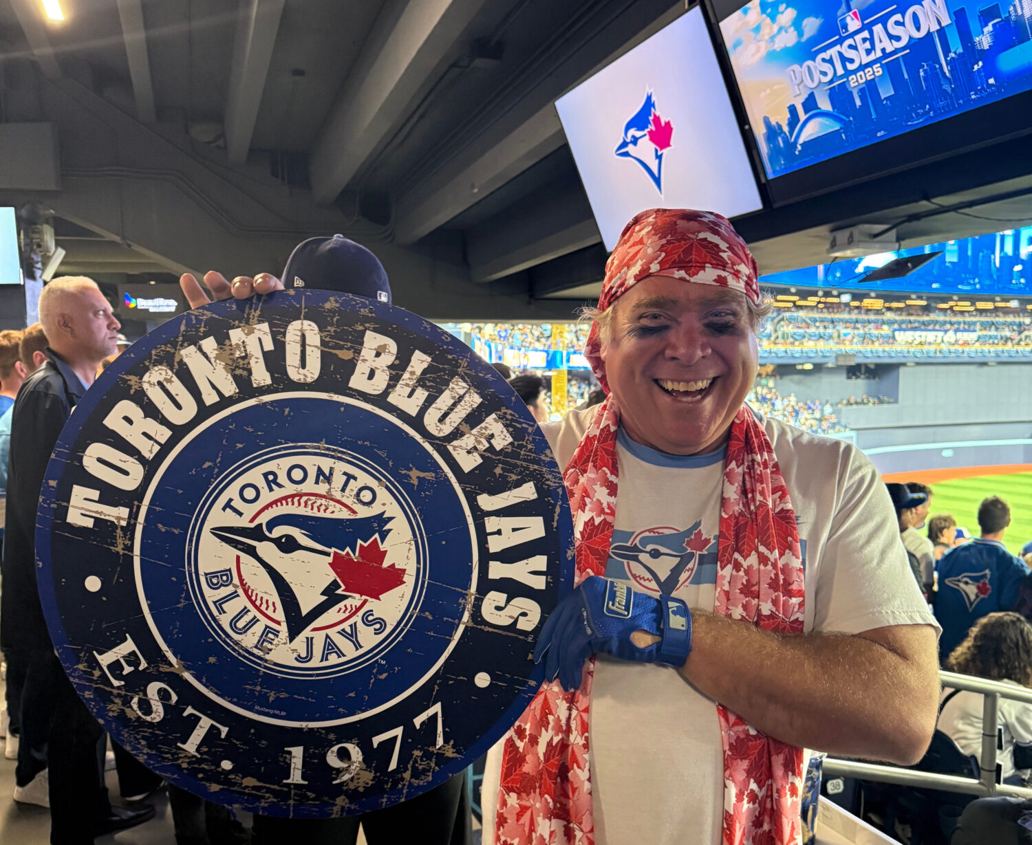 Toronto Blue Jays fan Geoffrey Fulton poses with his Blue Jays gear and maple leaf bandana during G...