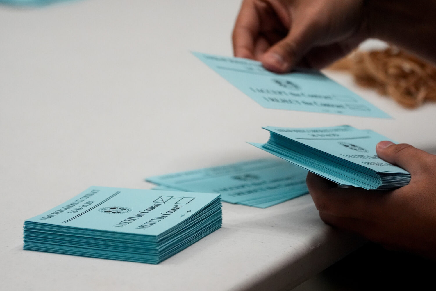 FILE - A volunteer sorts votes on a new contract offer from Boeing, Nov. 4, 2024, at the IAM Distri...