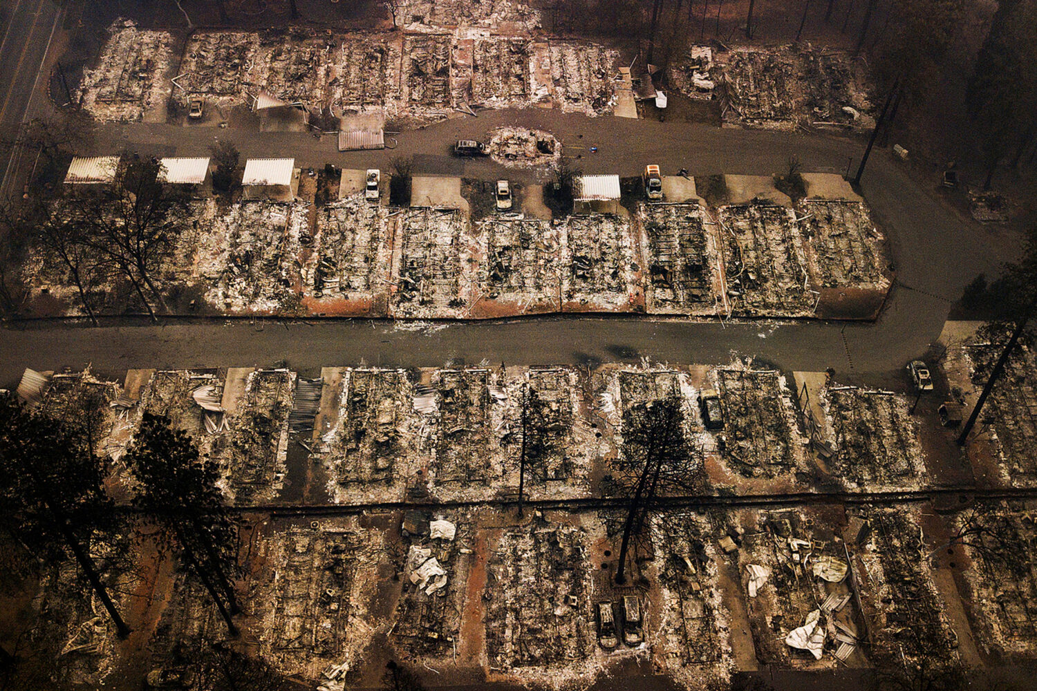 FILE - The remains of homes leveled by the Camp wildfire, appear in Paradise, Calif., on Nov. 15, 2...