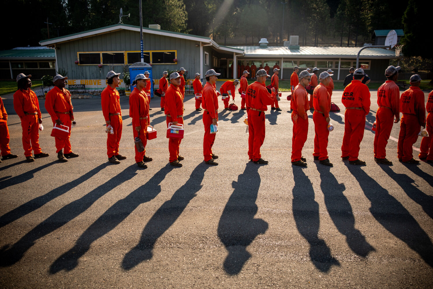 Participants in the Youth Offender Program Camp Pilot Program line up before work at the Pine Grove...
