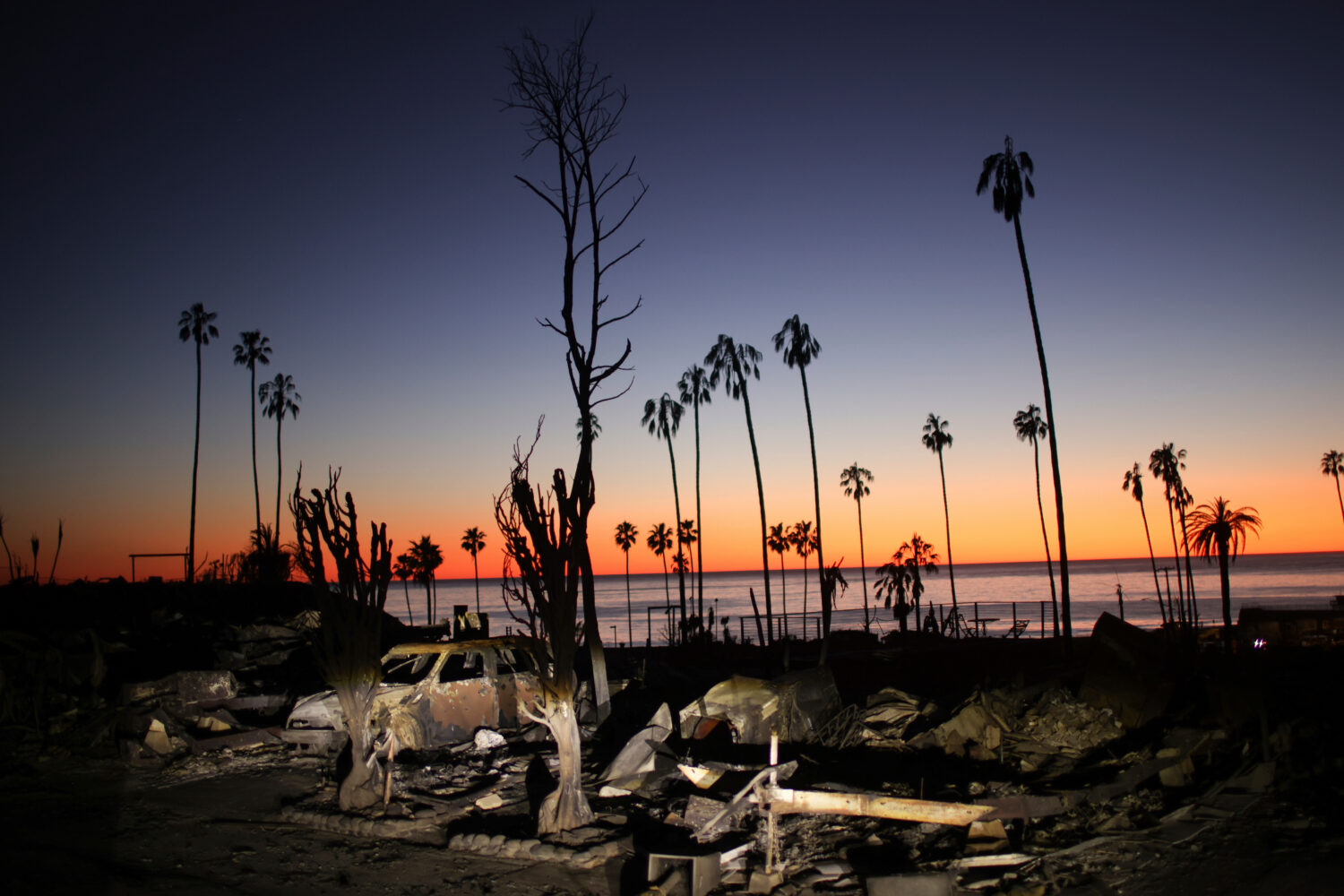 FILE - The devastation of the Palisades Fire is seen at sunset in the Pacific Palisades neighborhoo...