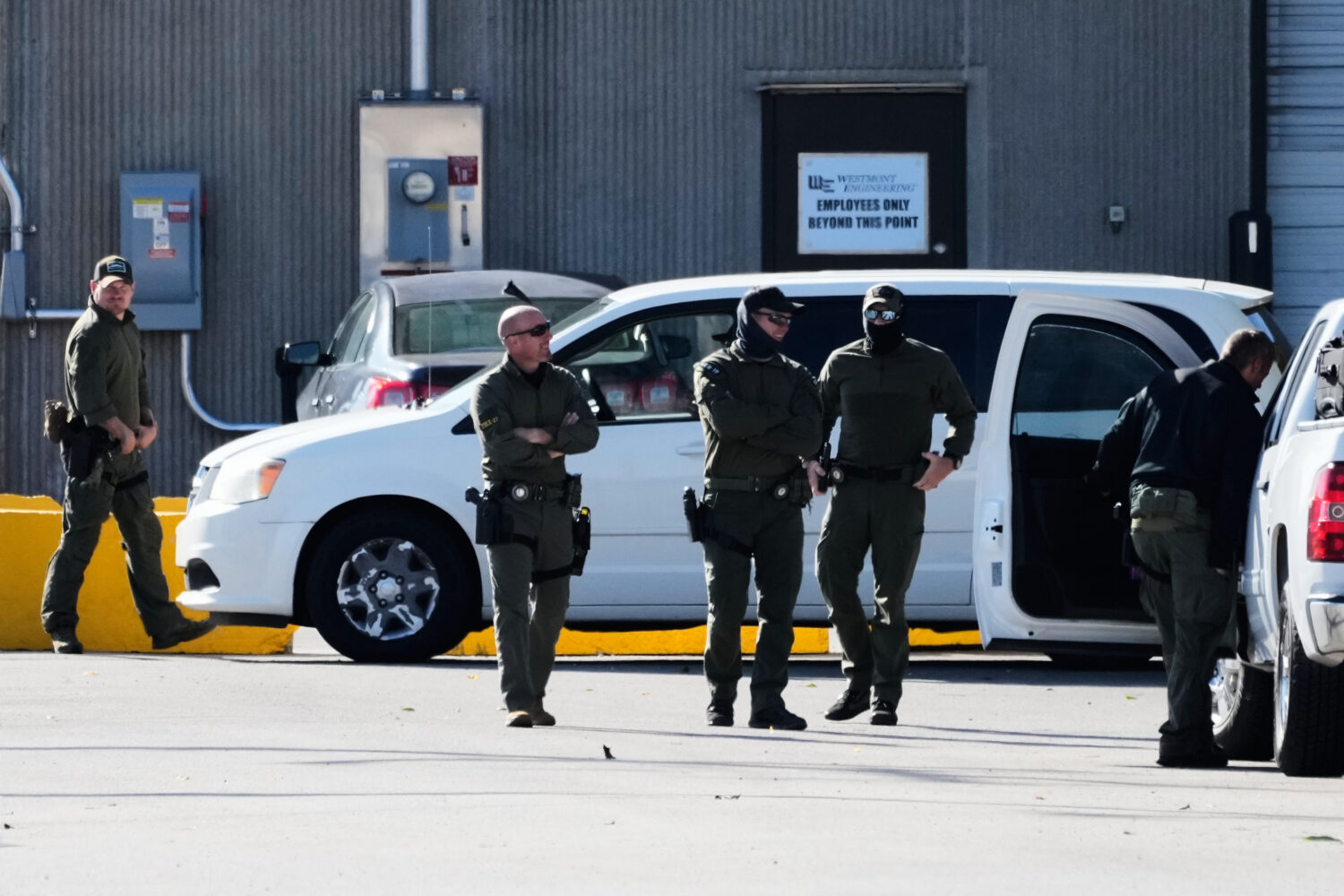 Federal Patrol agents stand outside an ICE processing facility in the Chicago suburb of Broadview, ...
