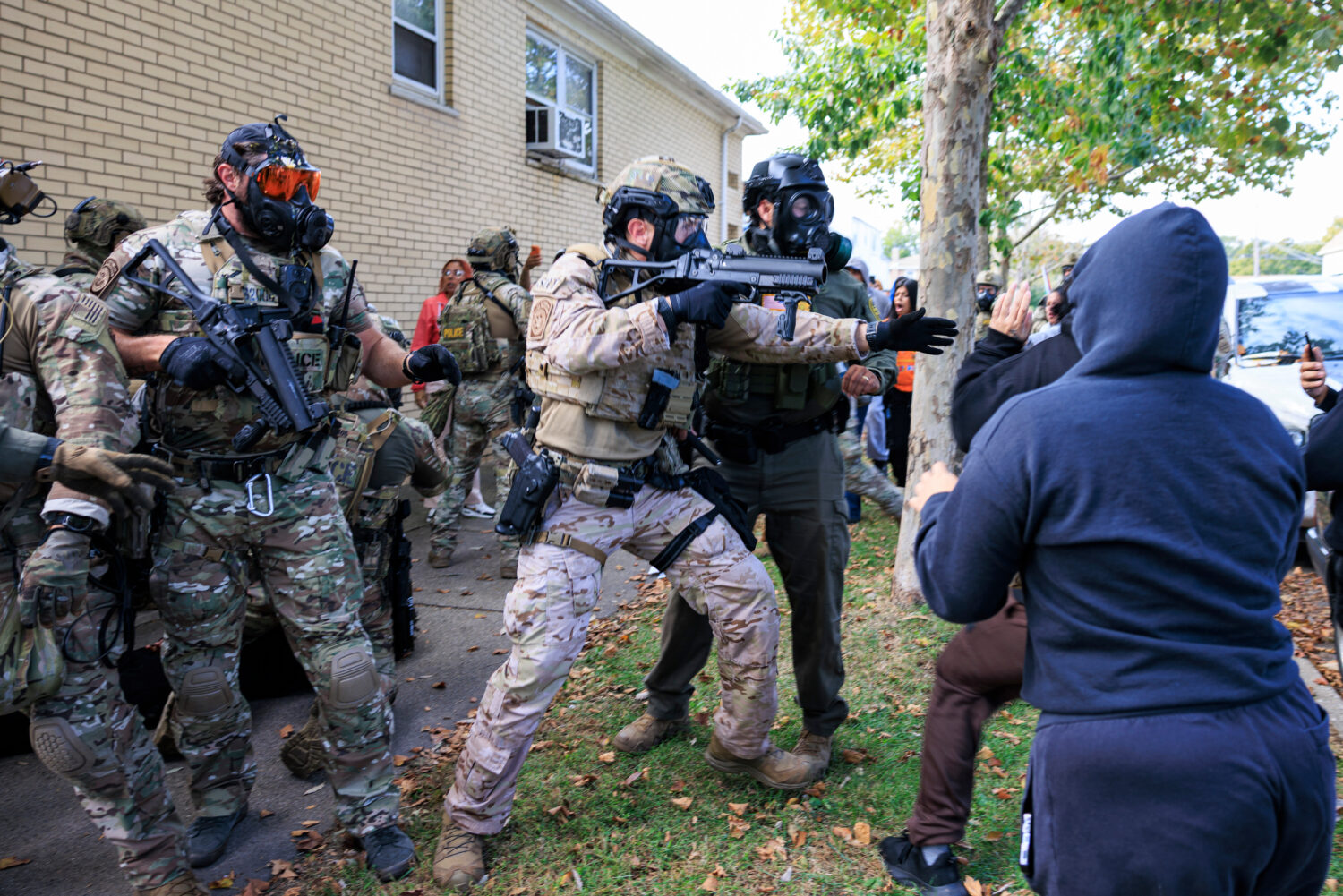 Government officials push back protesters in Chicago, Tuesday, Oct. 14, 2025. (Anthony Vazquez/Chic...