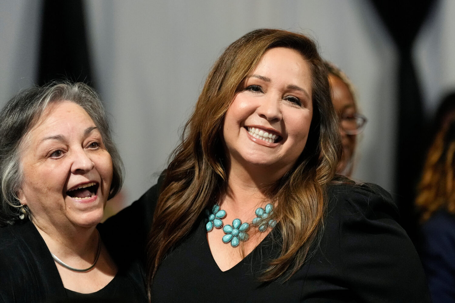 FILE - Arizona Democratic candidate Adelita Grijalva, right, smiles as she celebrates with her moth...