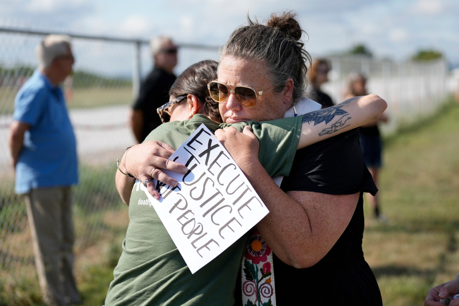 FILE - India Pungarcher, left, hugs Rev. Ingrid McIntyre as demonstrators gather in the area reserv...
