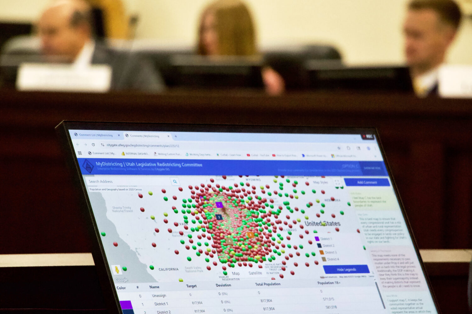 Lawmakers look at a display of public comments on their congressional redistricting proposals, Mond...