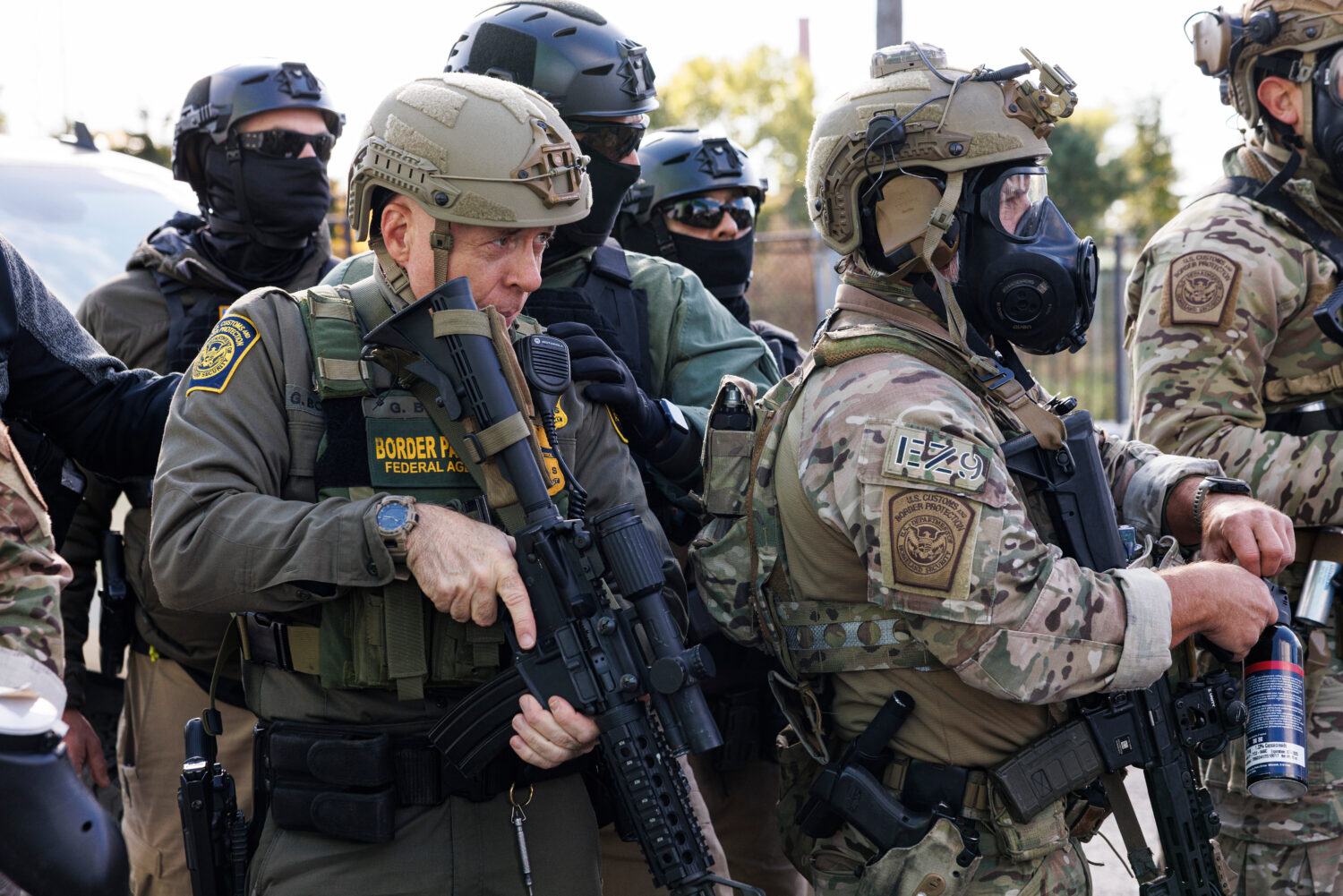 U.S. Border Patrol Commander-At-Large Gregory Bovino stands with federal immigration enforcement ag...
