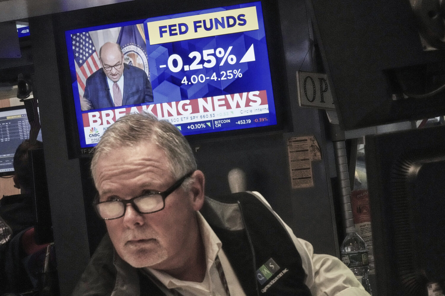 Trader Michael Conlon works on the floor of the New York Stock Exchange as the rate decision of the...
