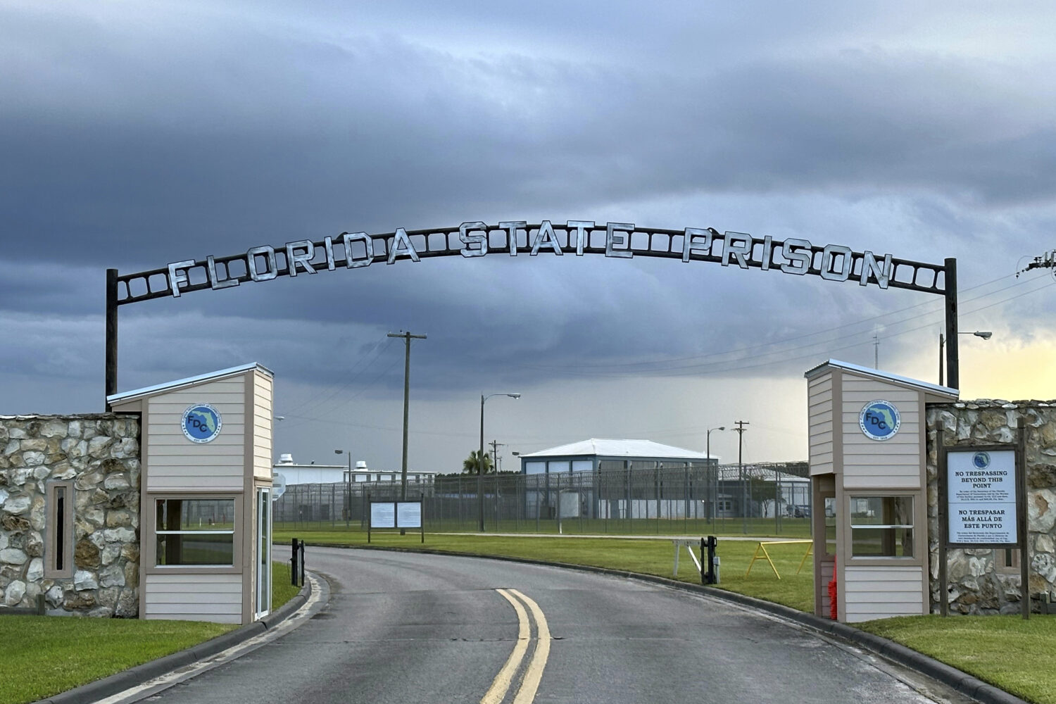 FILE - Clouds hover over the entrance of the Florida State Prison in Starke, Fla., Aug. 3, 2023. (A...