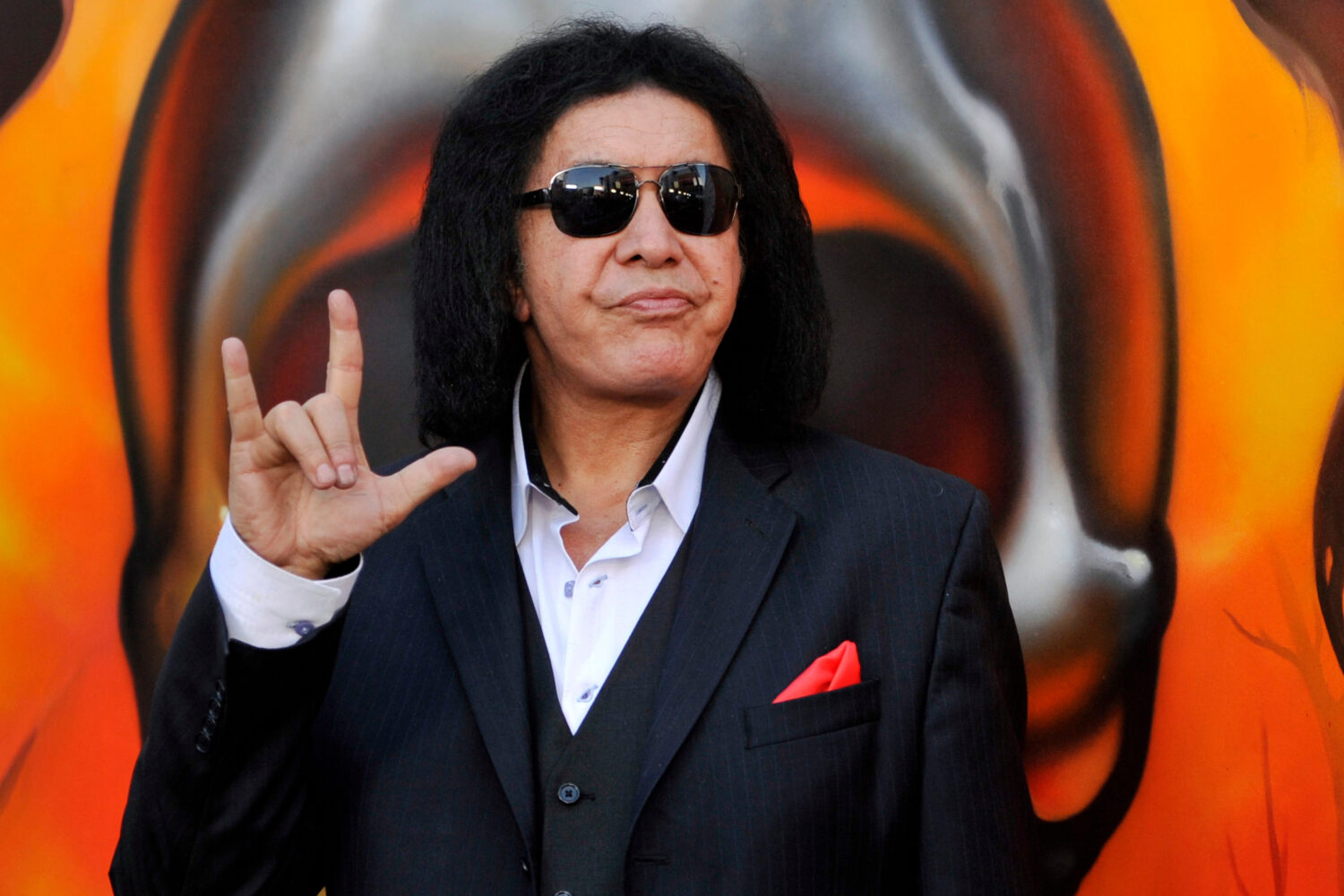 FILE - Gene Simmons of Kiss poses before the 2013 Revolver Golden Gods Award Show at Club Nokia on ...