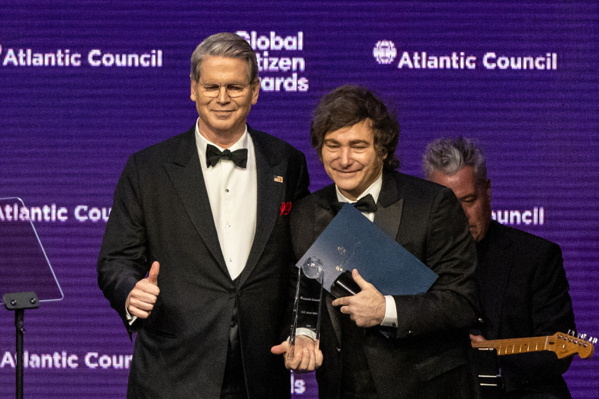 United States Secretary of the Treasury, Scott Bessent presents an award to the President of Argent...