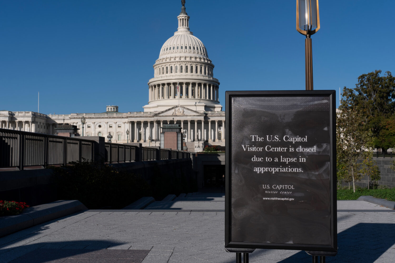 With the government shutdown now in its third week, a sign turns away tourists at the entrance to t...
