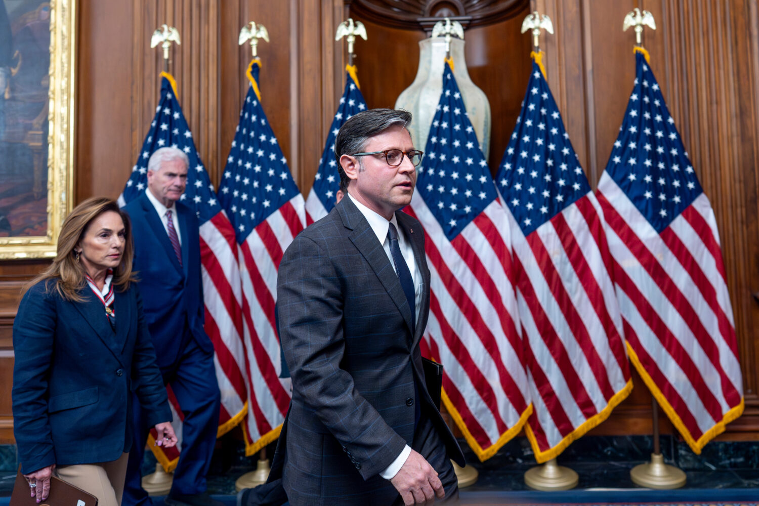Speaker of the House Mike Johnson, R-La., center, joined from left by Rep. Lisa McClain, R-Mich., c...