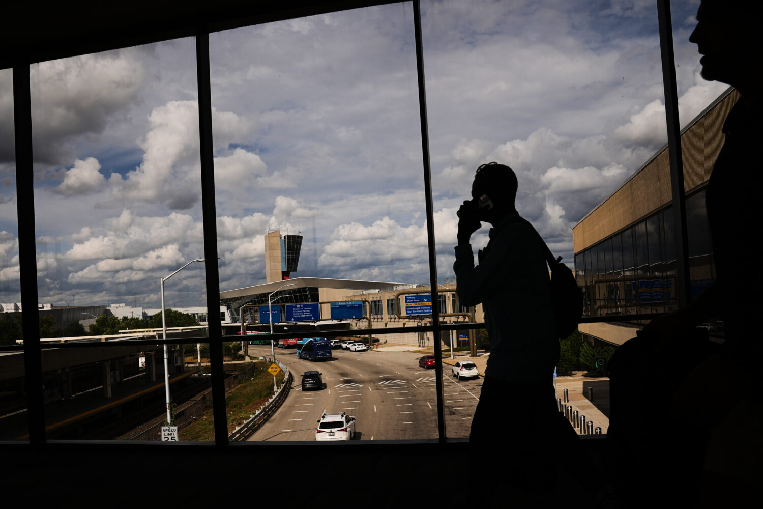 Passengers walk from a terminal at Philadelphia International Airport in Philadelphia, Tuesday, Oct...