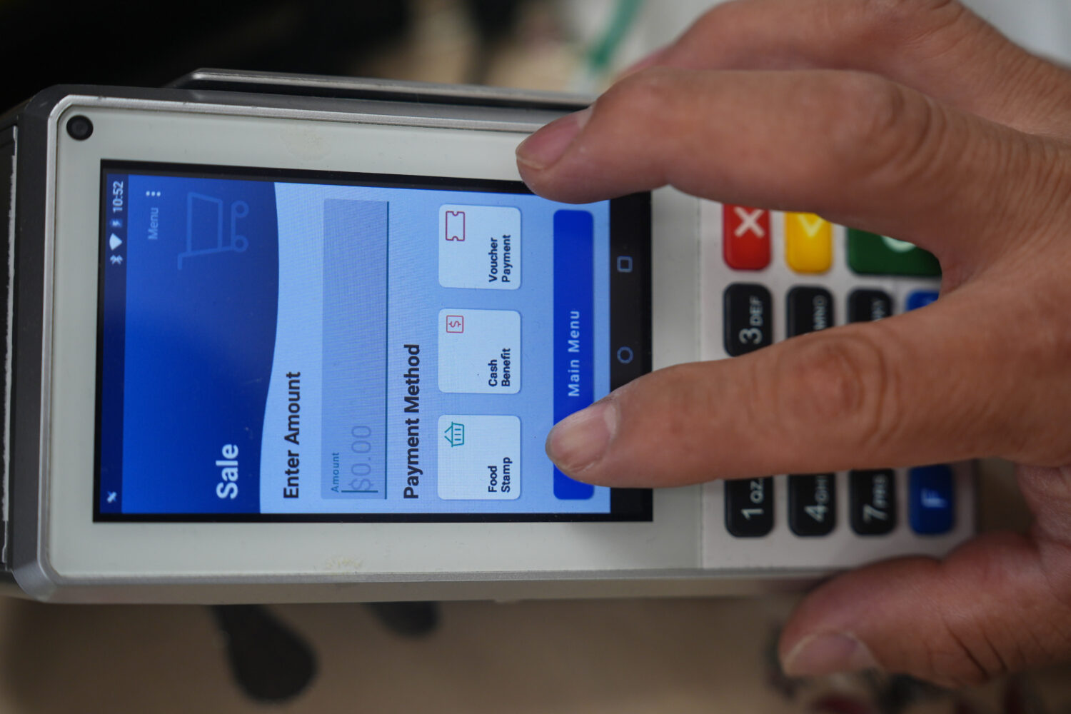 A shopper makes a purchase with food stamps on Monday, Oct. 27, 2025, in Los Angeles. (AP Photo/Dam...