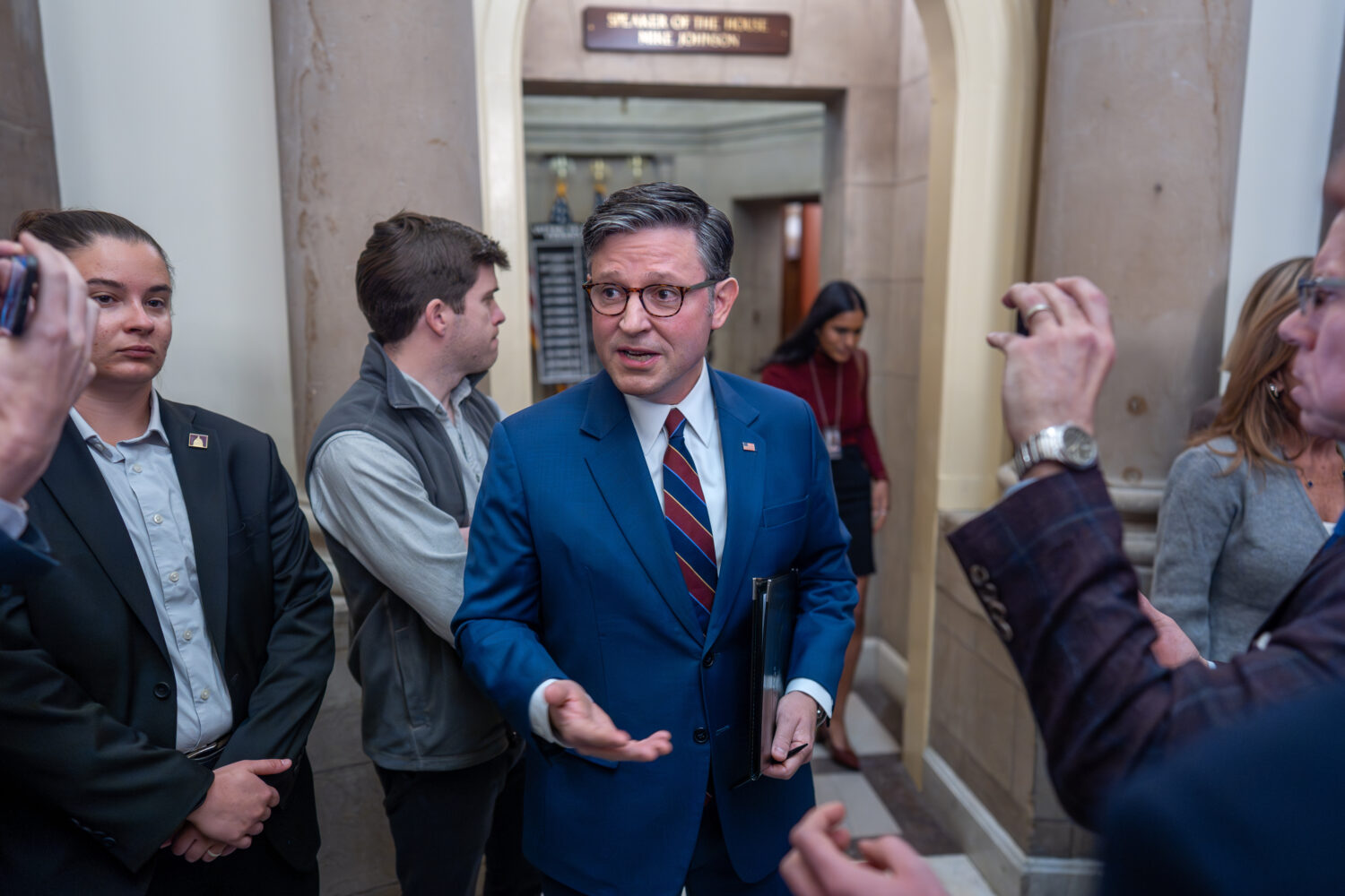 Speaker of the House Mike Johnson, R-La., talks to reporters outside his office on day 28 of the go...