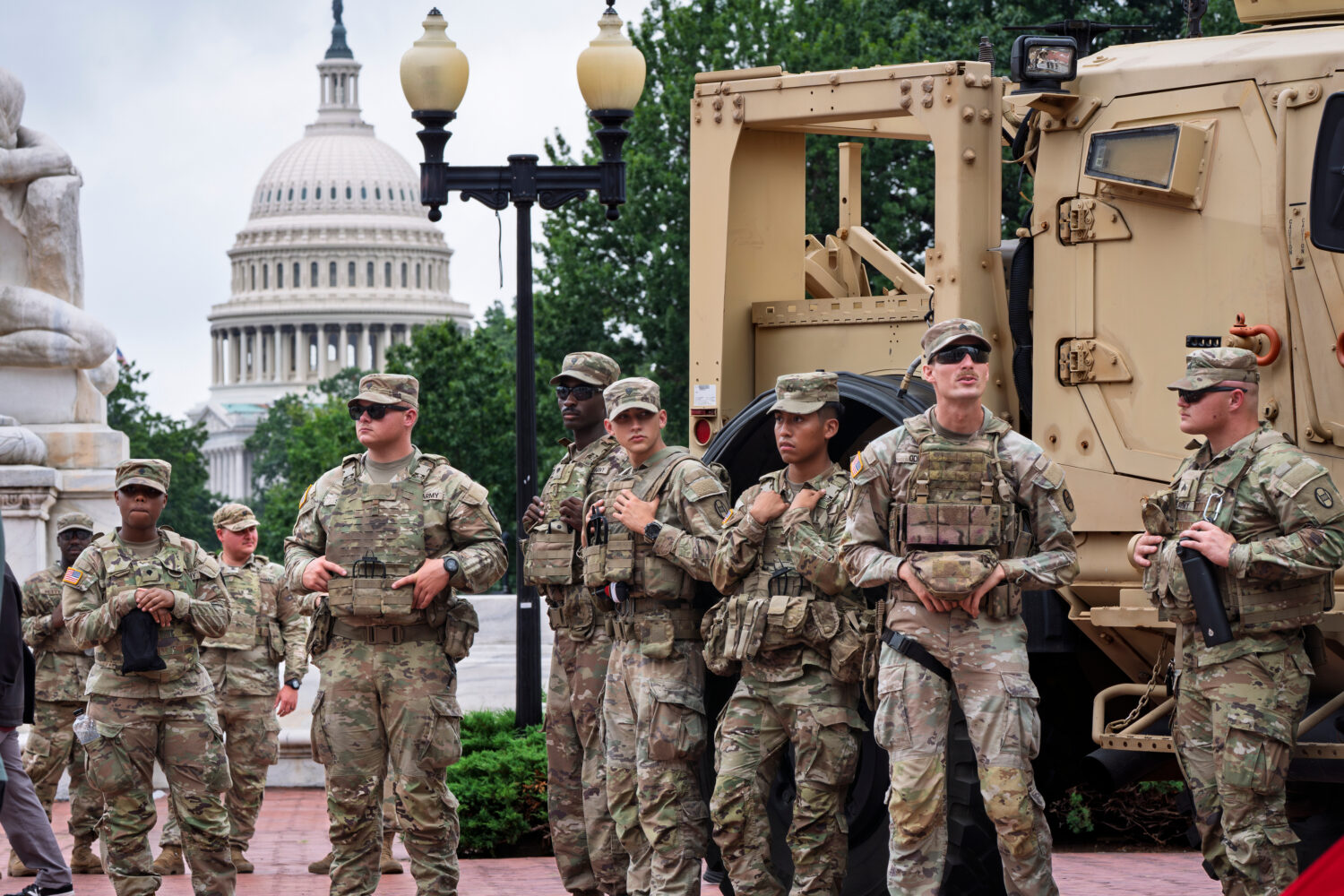 FILE - National Guard troops congregate at the entrance to Union Station in Washington, Aug. 20, 20...