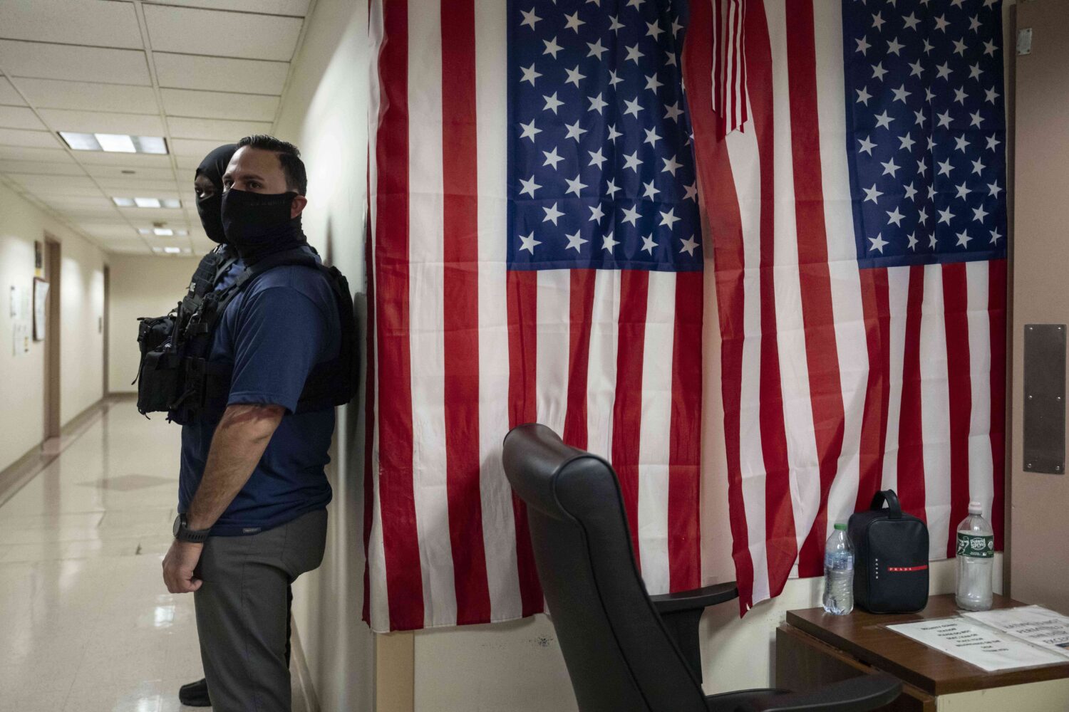 Federal agents stand outside an immigration court at the Jacob K. Javits federal building in New Yo...
