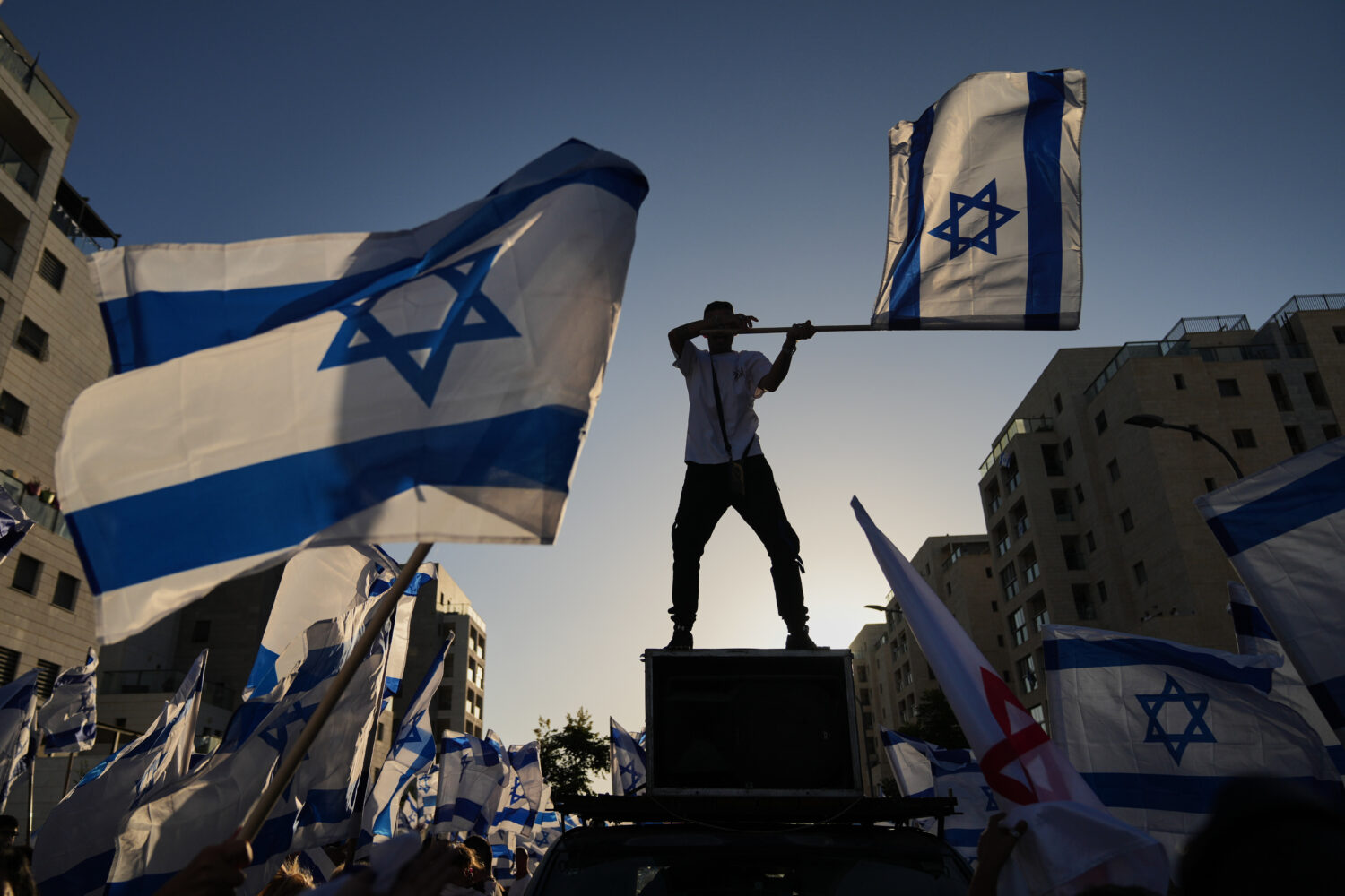 People gather to welcome freed Israeli hostage, Elkana Bohbot, who was recently released from Hamas...