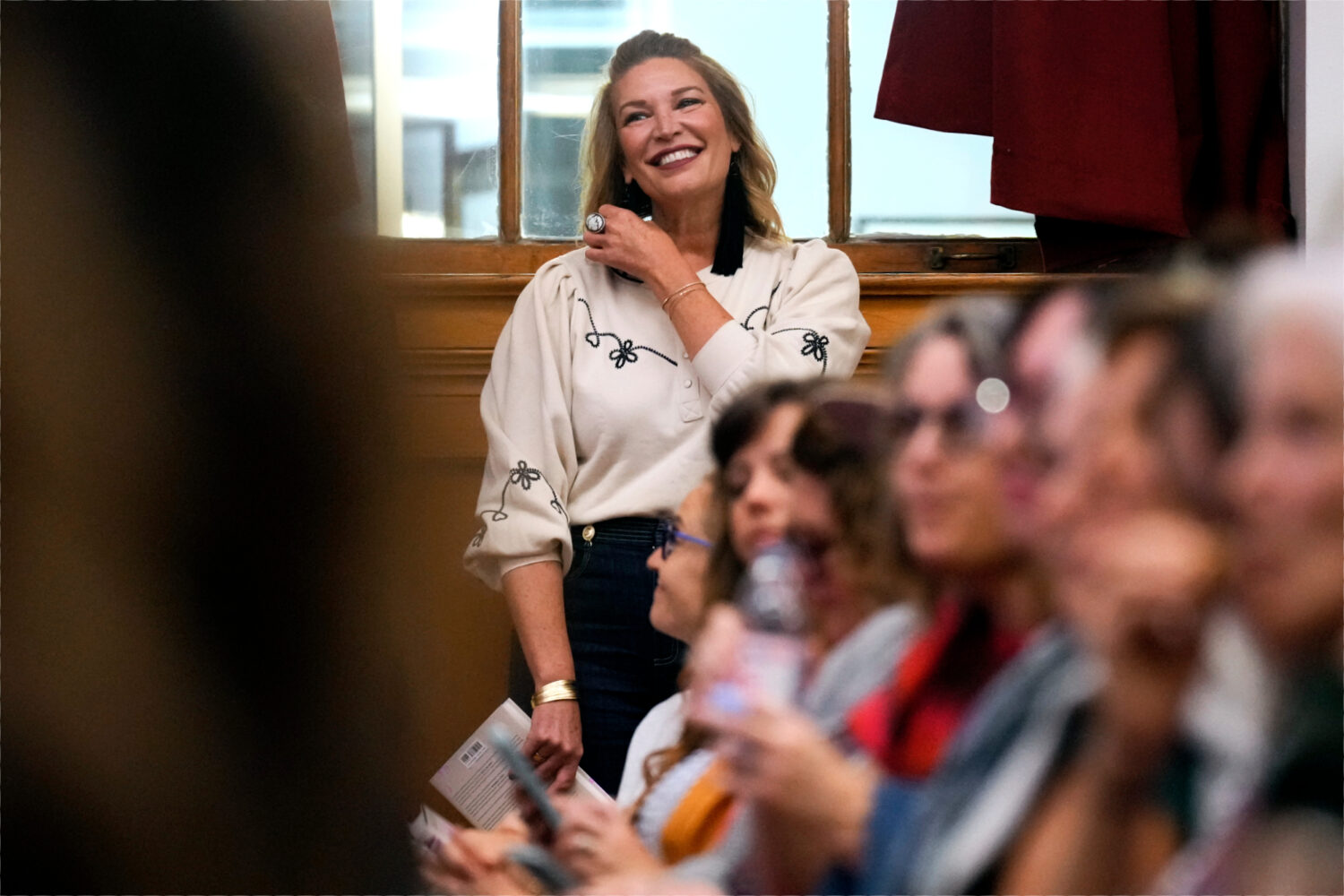 Best-selling Christian writer and influencer Jen Hatmaker waits to be introduced to talk about her ...