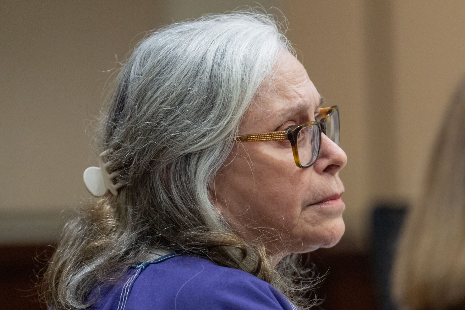 Donna Adelson listens to statements made on her behalf by family friends during her sentencing for ...