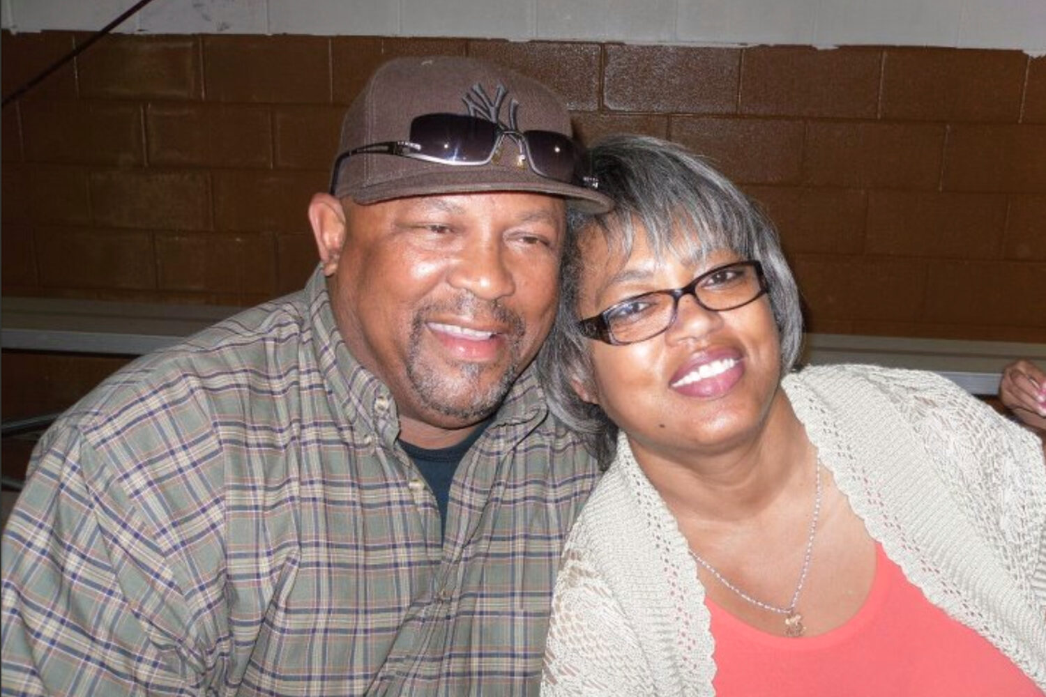 This August 2011 photo provided by Qureshi Law shows Erie Moore, Sr. with his sister, Catherine Moo...