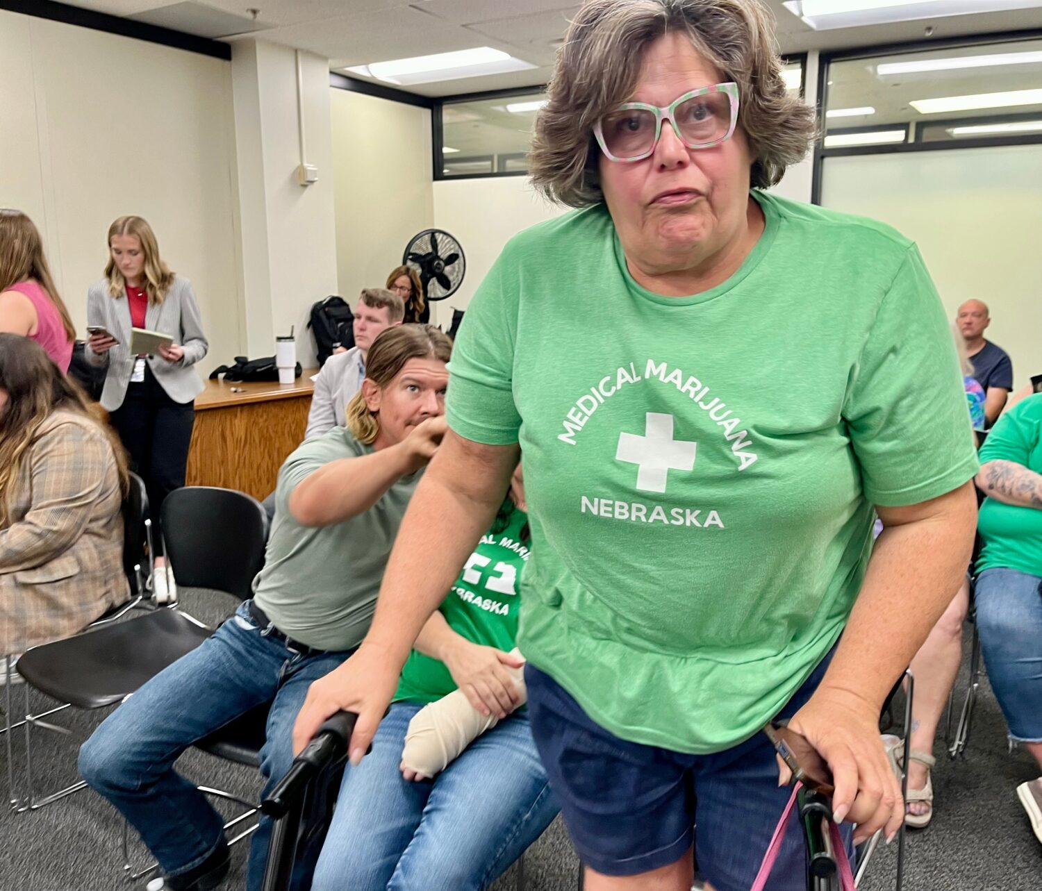Lia Post, of Springfield, Neb., leaves a meeting of the Nebraska Medical Cannabis Commission, where...